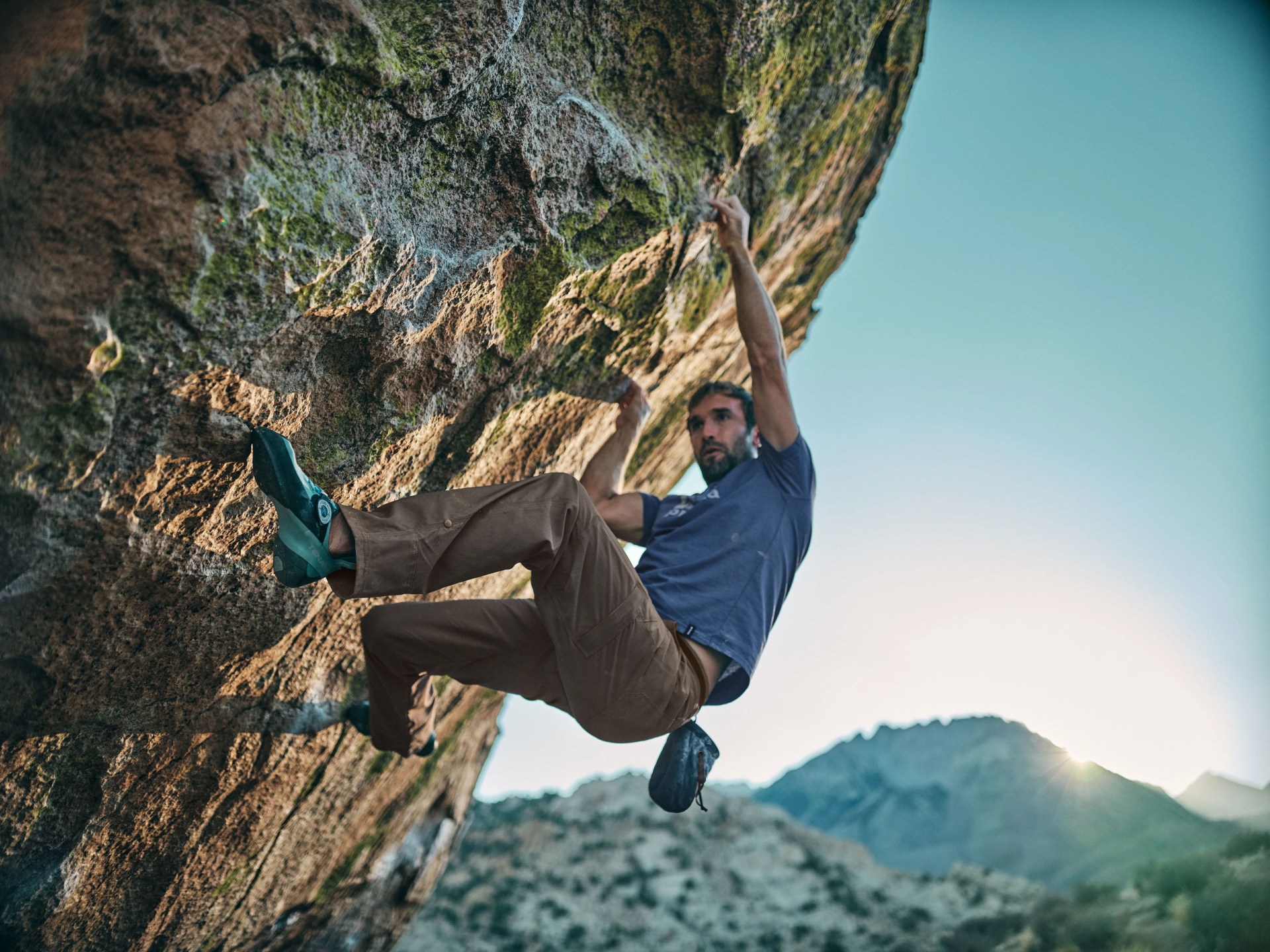 man bouldering wearing climbing gear from prana