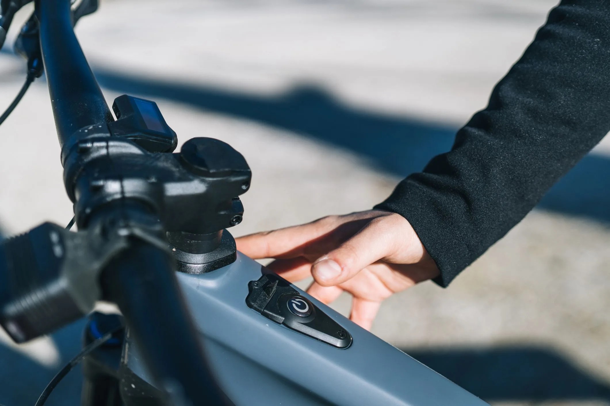 close up of young woman turning her e bike on