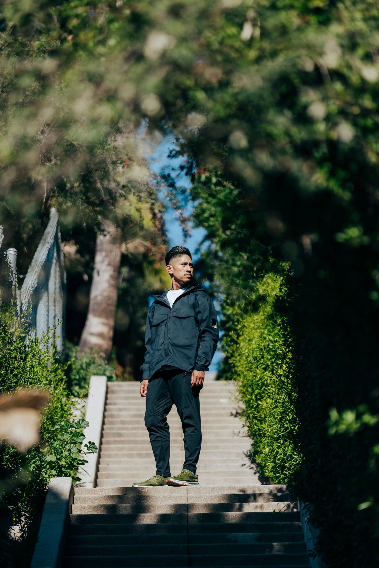 ja tecson wearing hoka transport sneakers