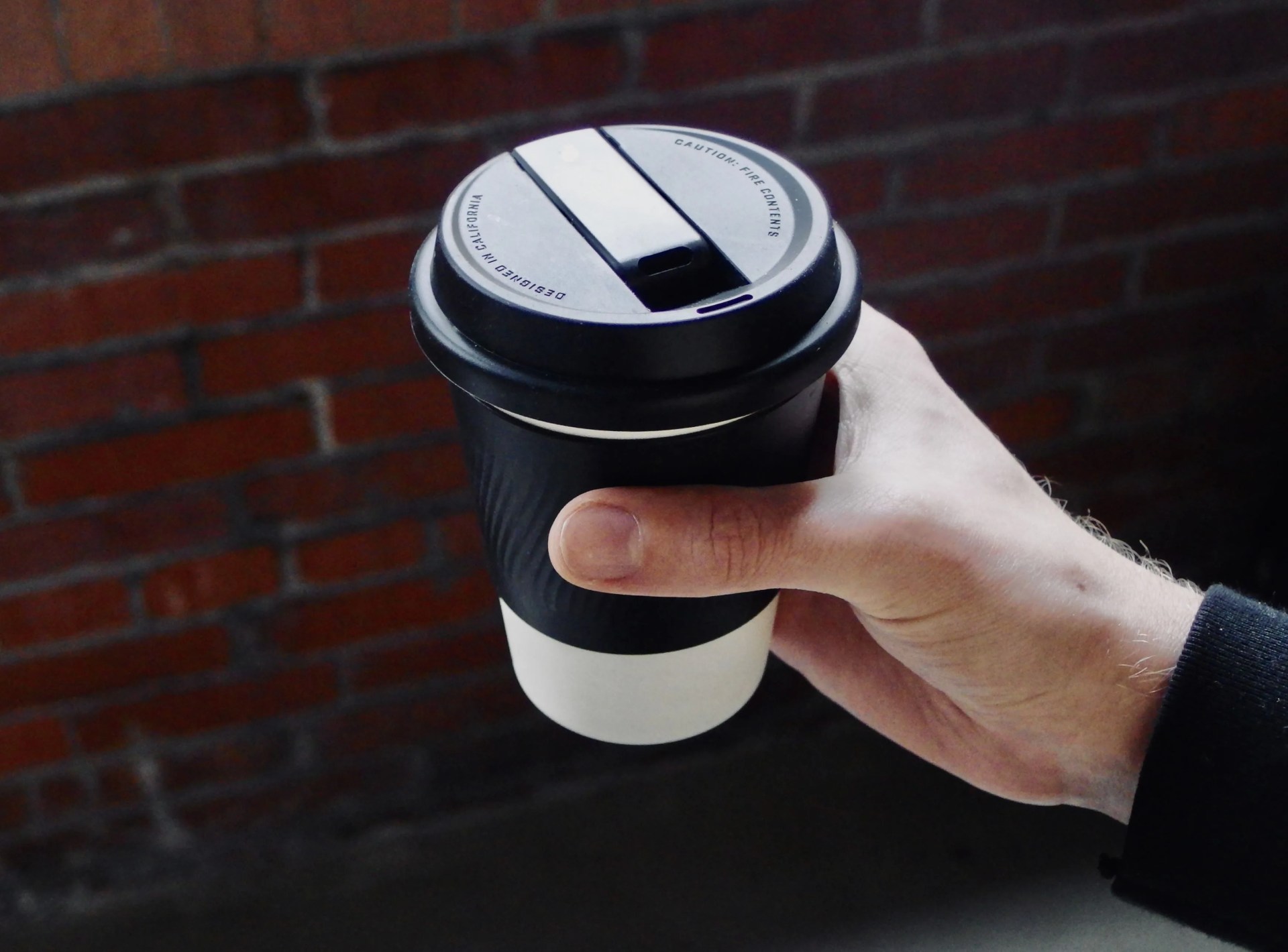 person holding a puffco cupsy