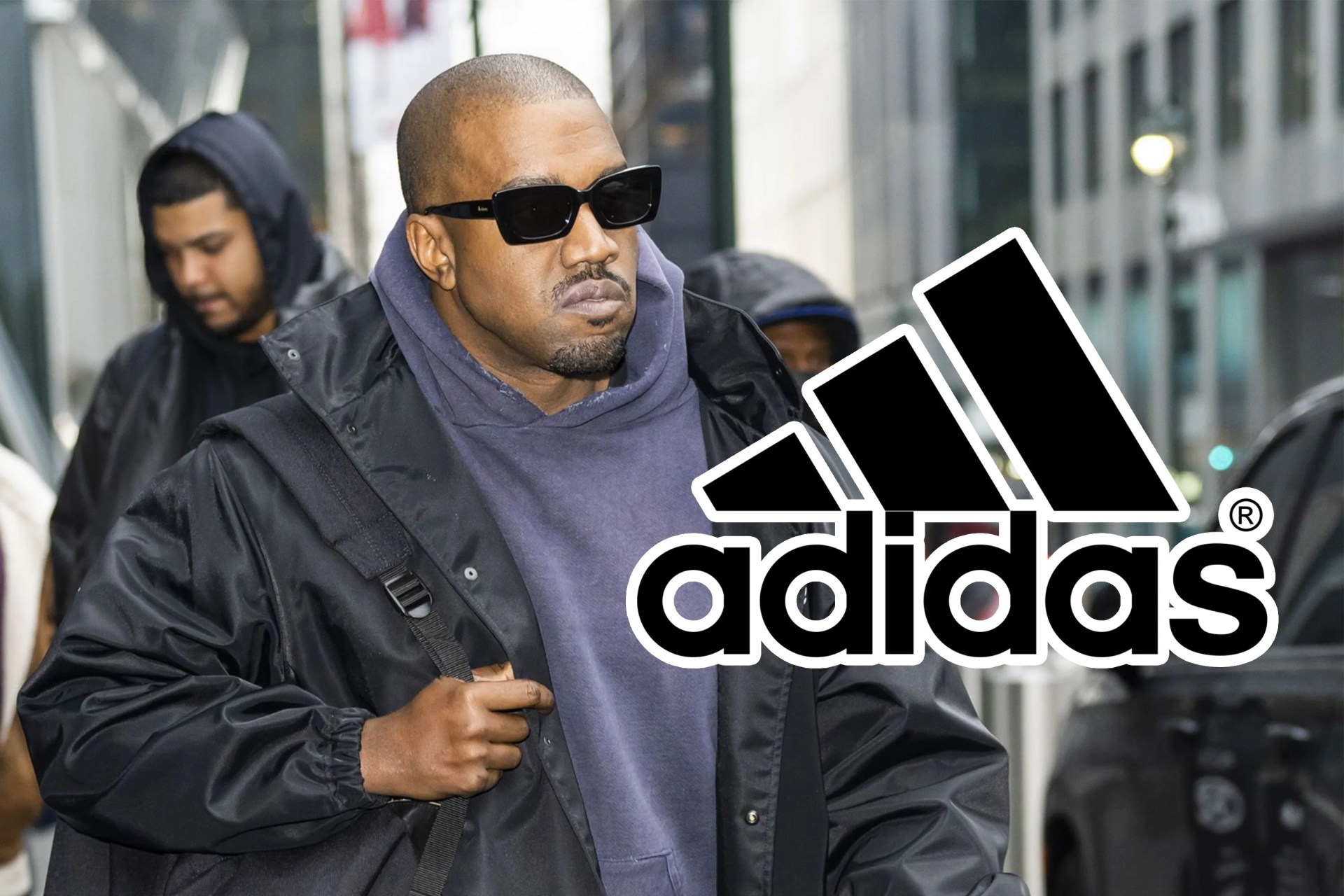 kanye west walking down the street with an adidas logo overlayed on the image