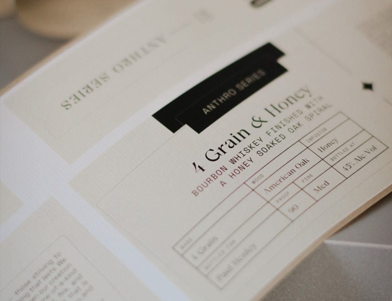 a close up shot of a white label that says grain and honey