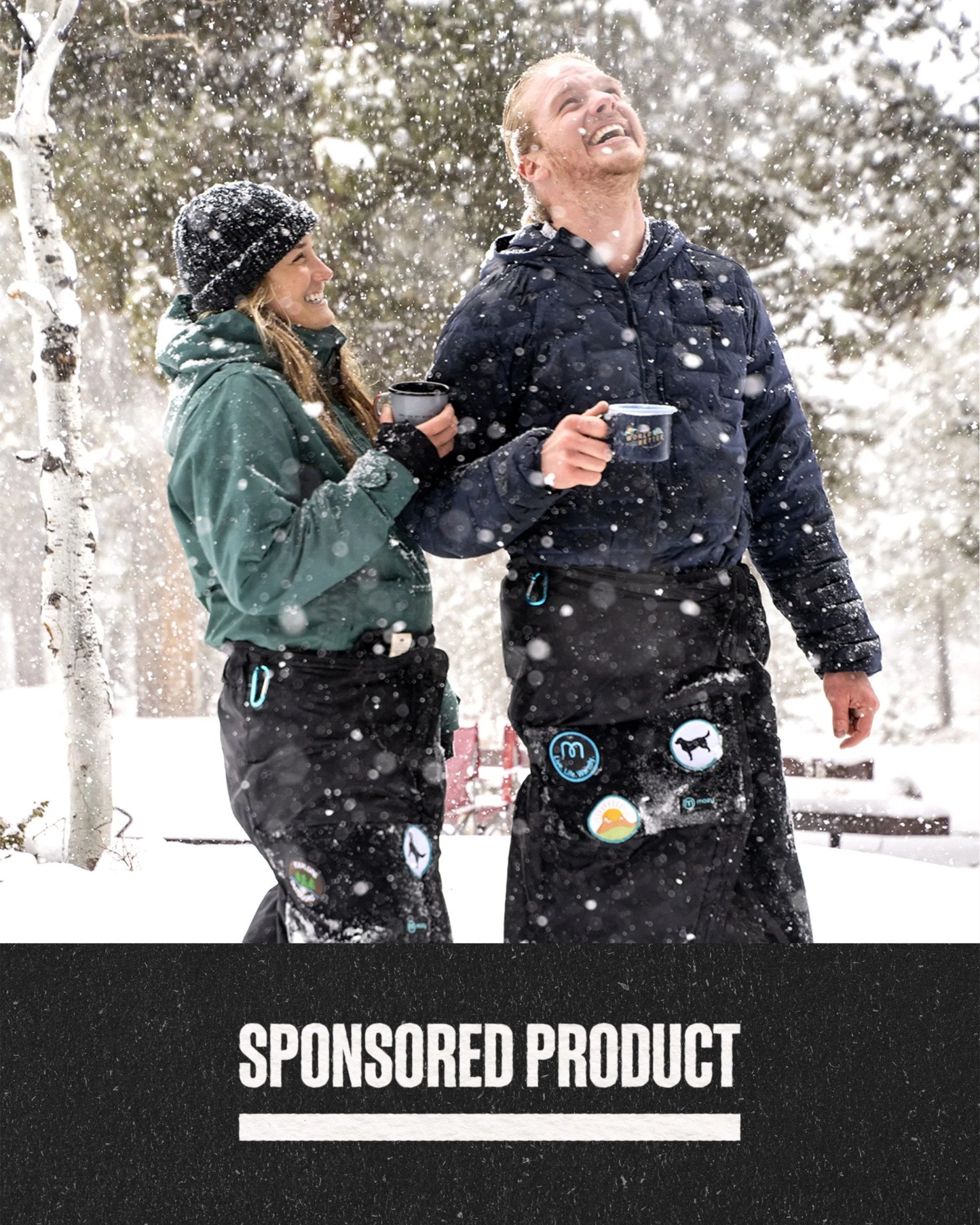 sponsored product two people looking up while it's snowing while using their mozy blankets