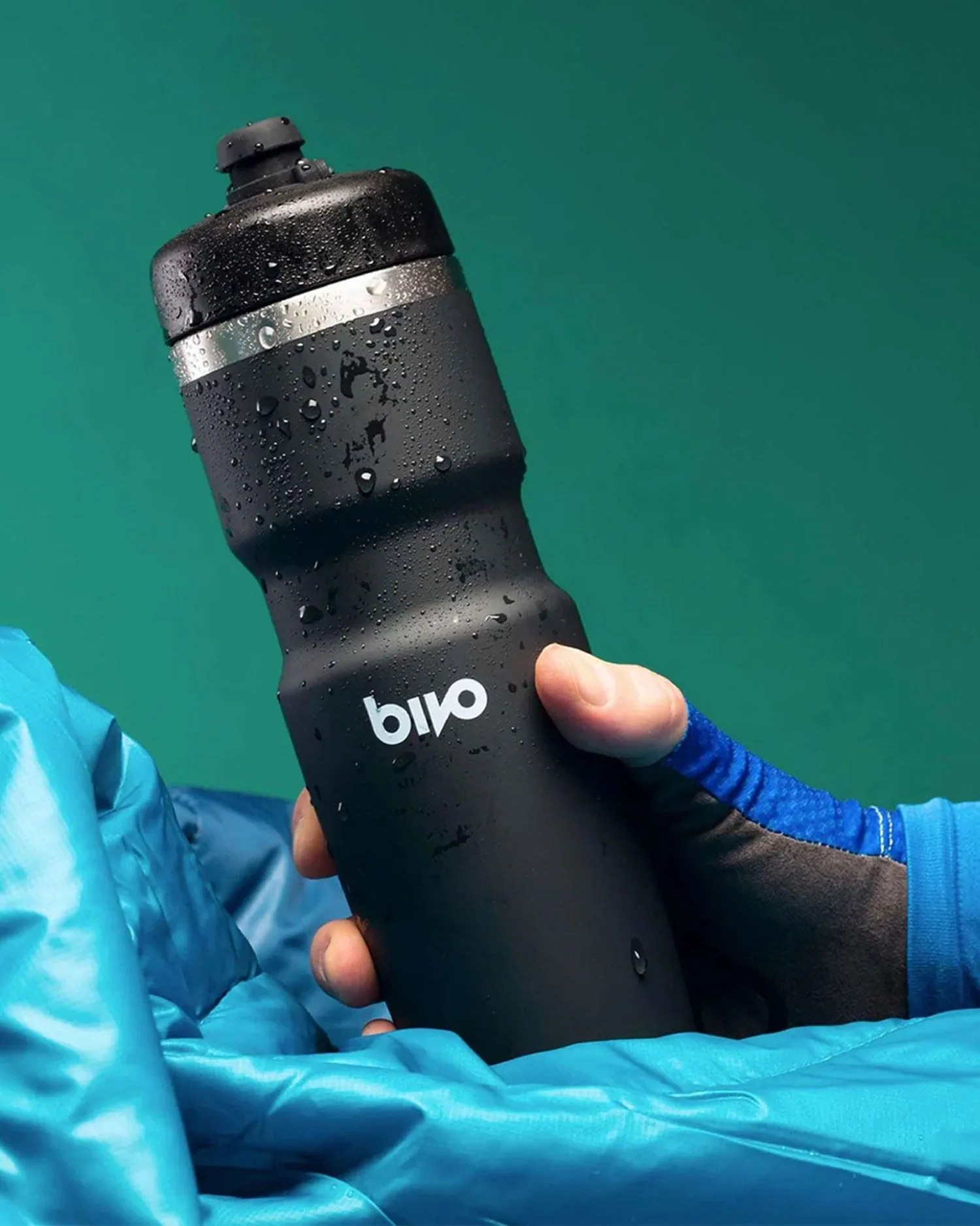 hand holding bivo insulated cycling bottle