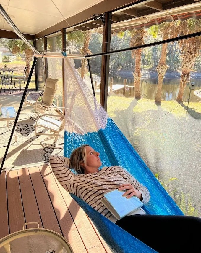 woman resting in hammock using hive hammock stand