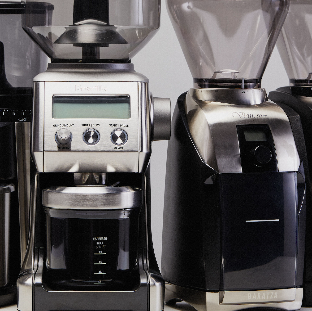 four coffee grinders side by side