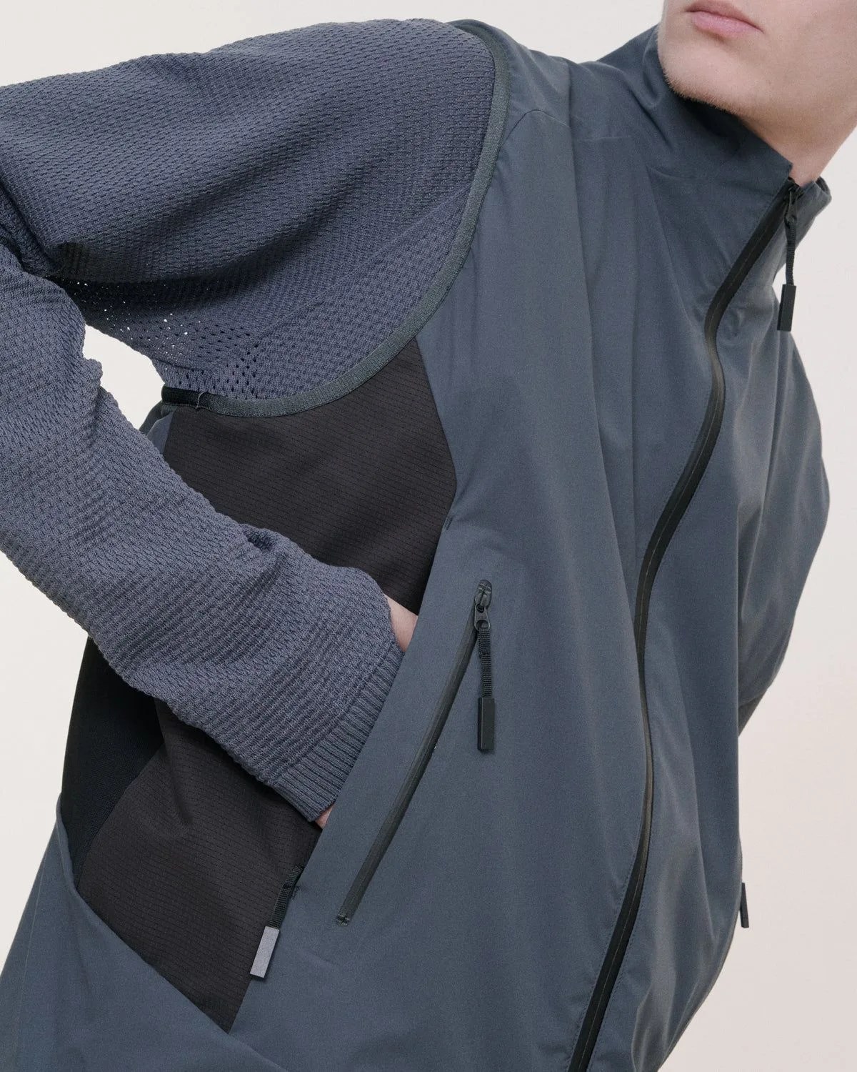 man wearing goldwin back pack vest