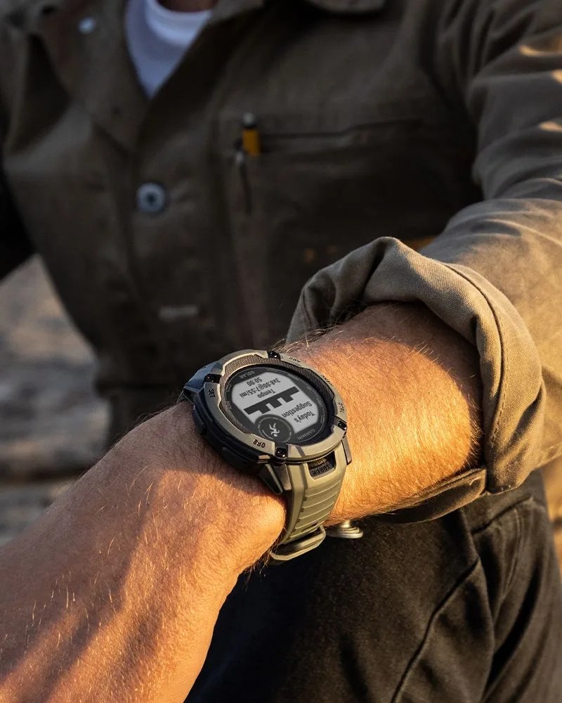 man wearing garmin instinct® 2x solar watch