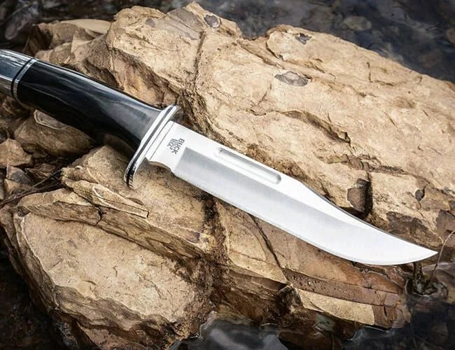 a large knife on a rock