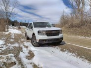 ford maverick parked by a dirt road