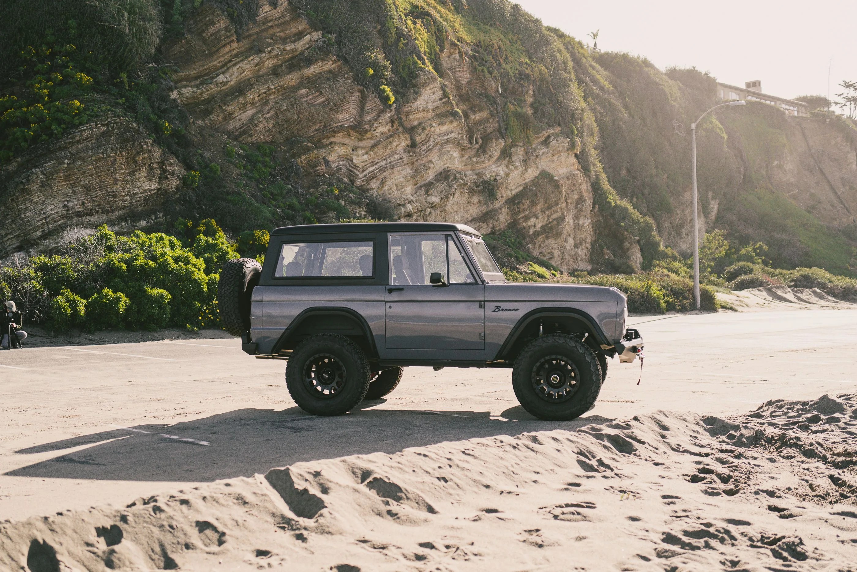 vintage bronco on a california beach