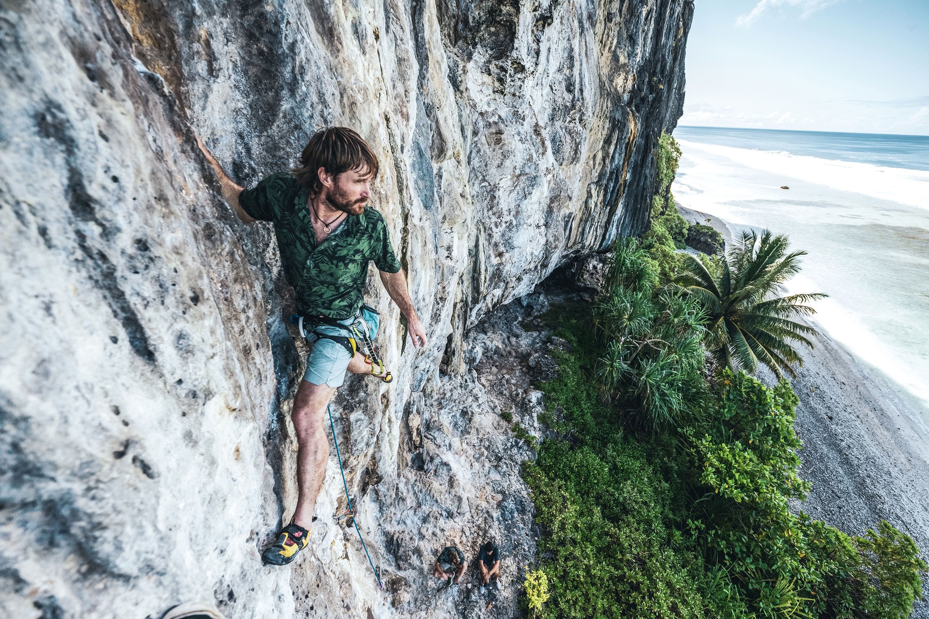 man climbing wall wearing roark bless up shirt