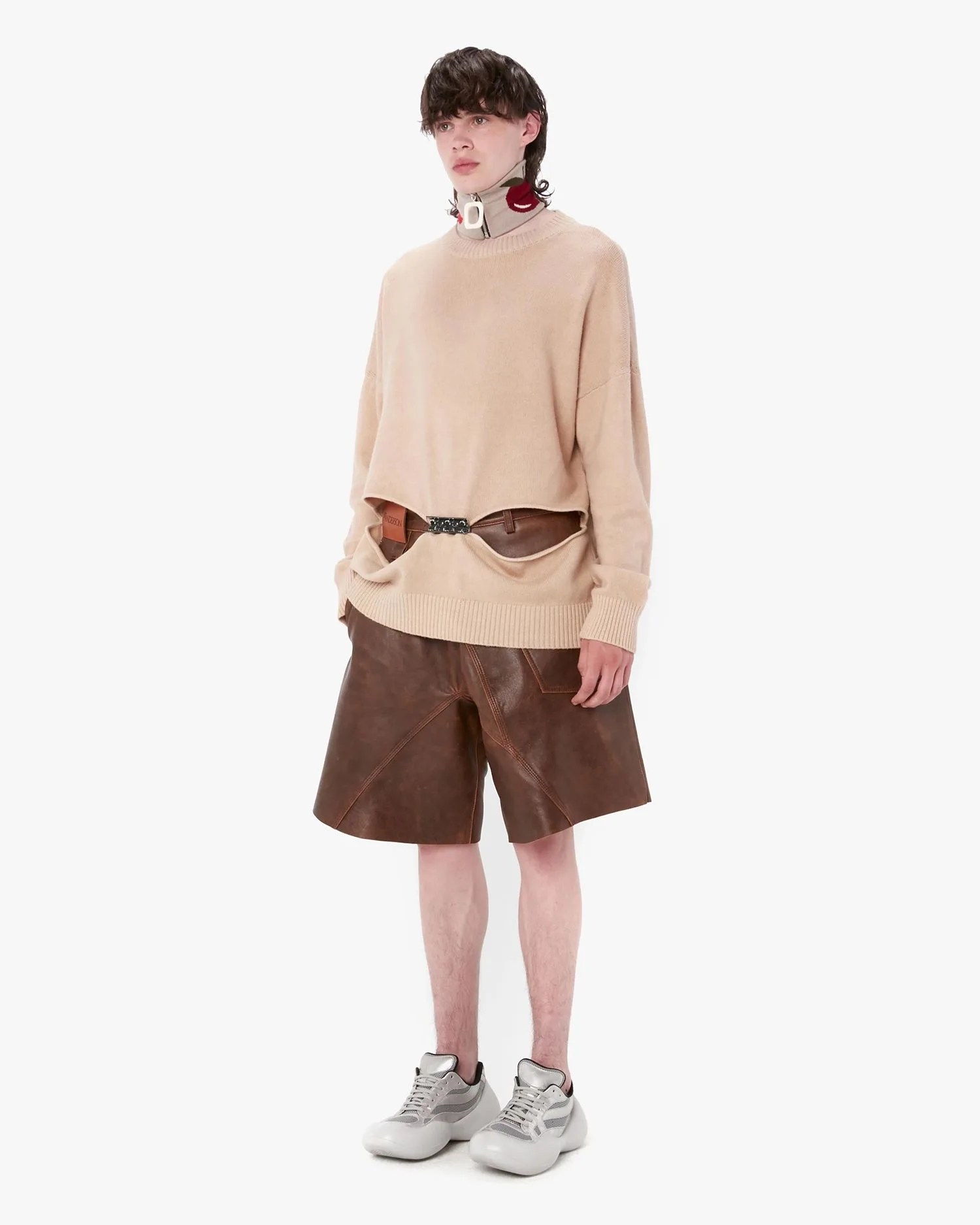 person wearing jw anderson bumper hike low top sneakers