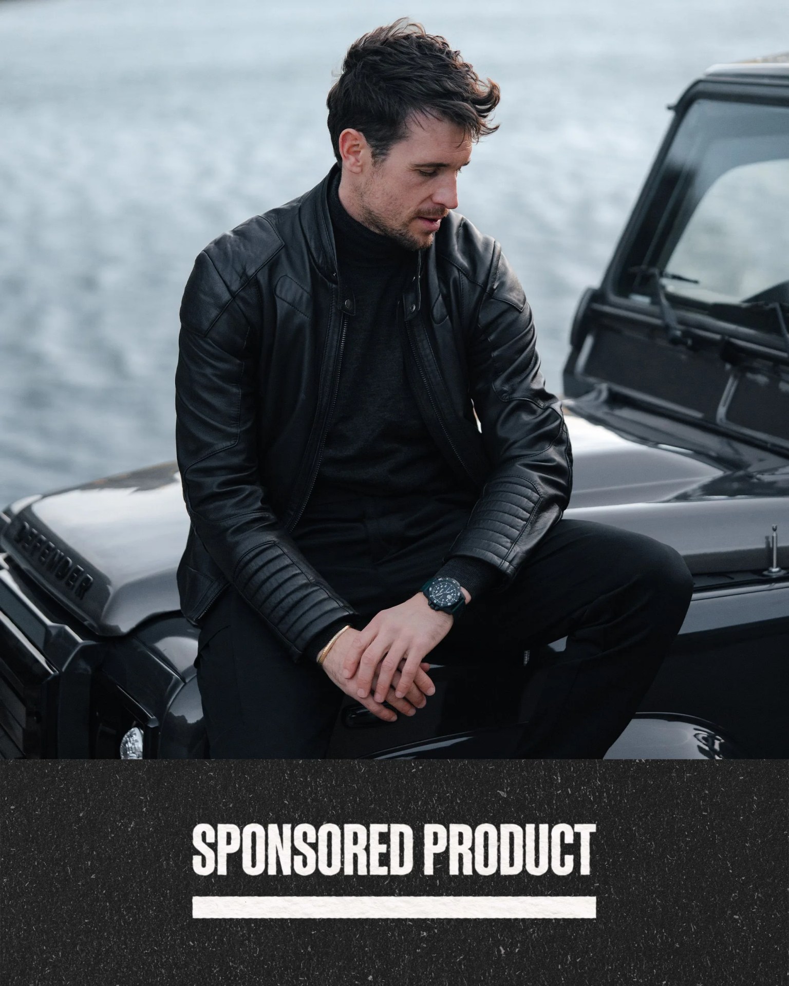 sponsored product man sitting on black car wearing green luminox watch