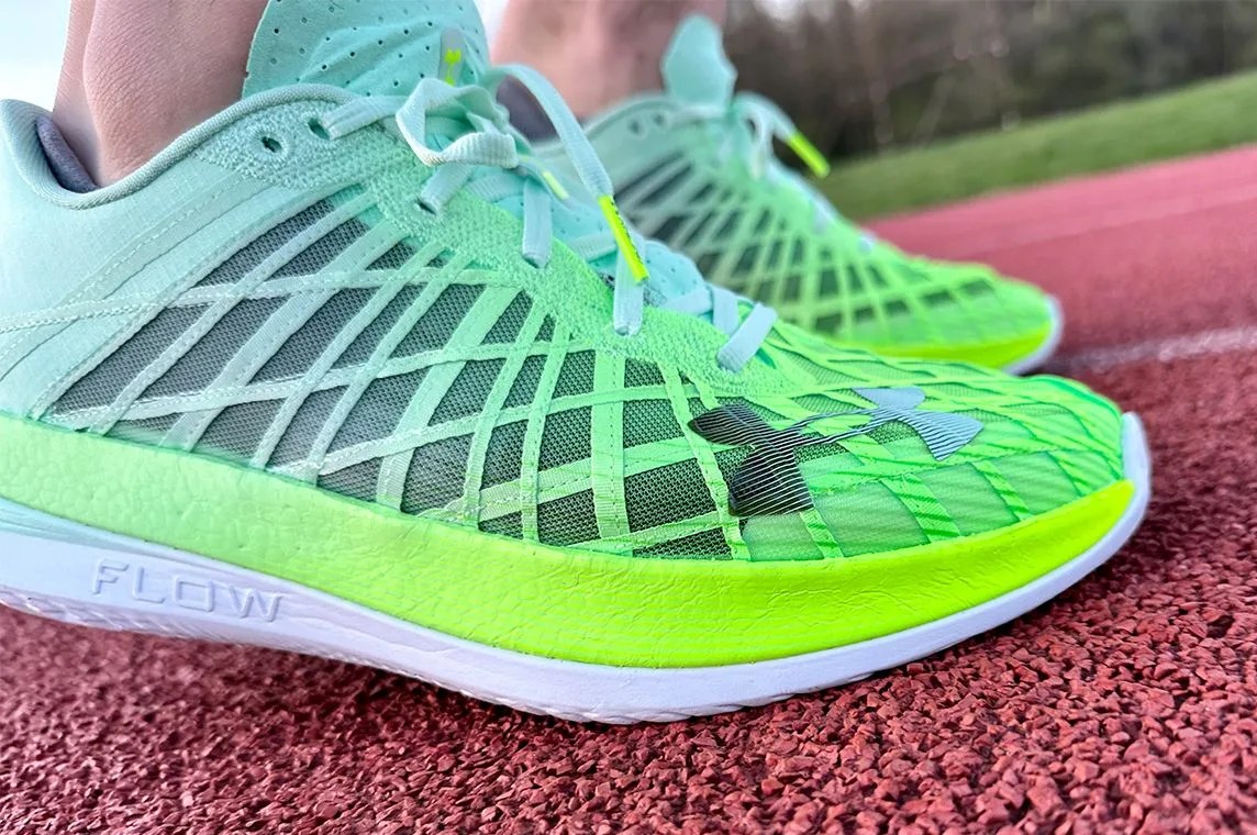 close up of a pair of running shoes on a track