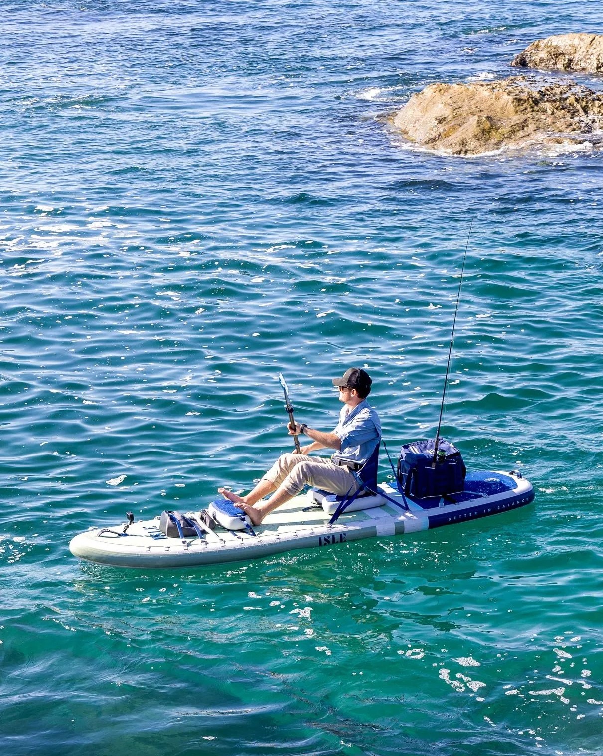 man sitting on pioneer pro premium sup kayak hybrid for all around use
