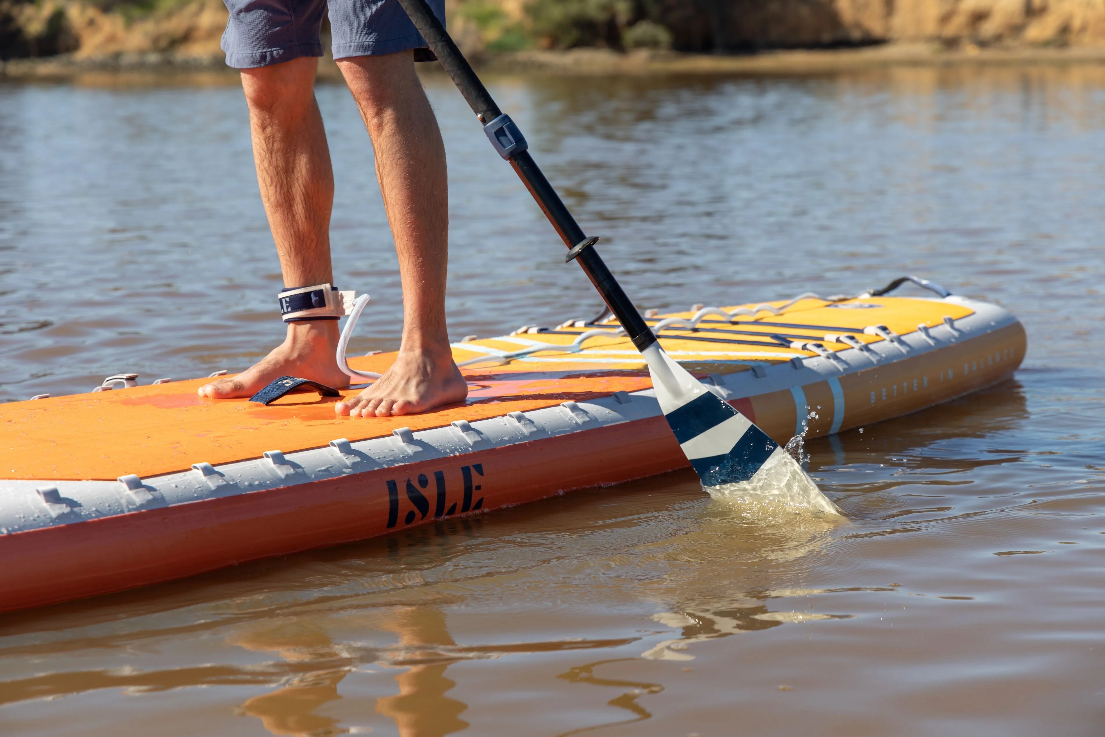 man on isle paddle board