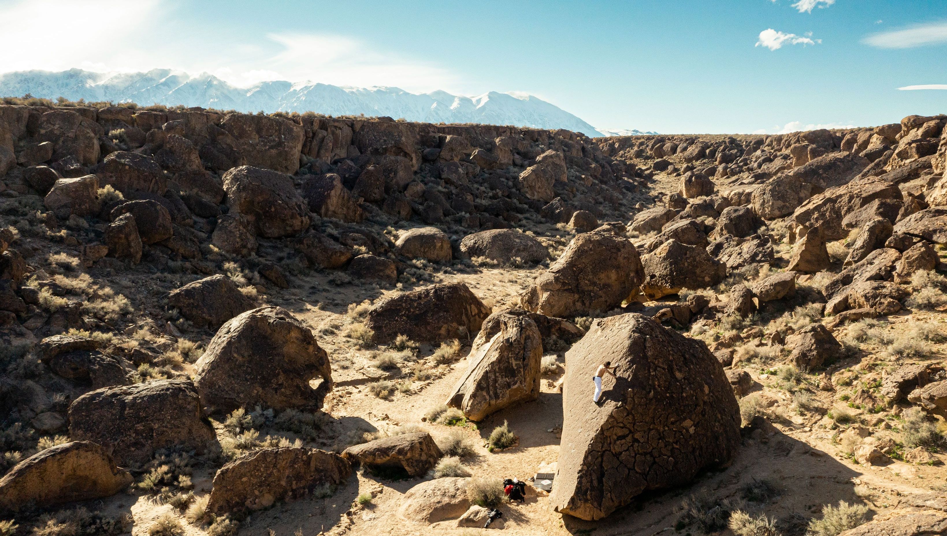 man walking through walking through canyon