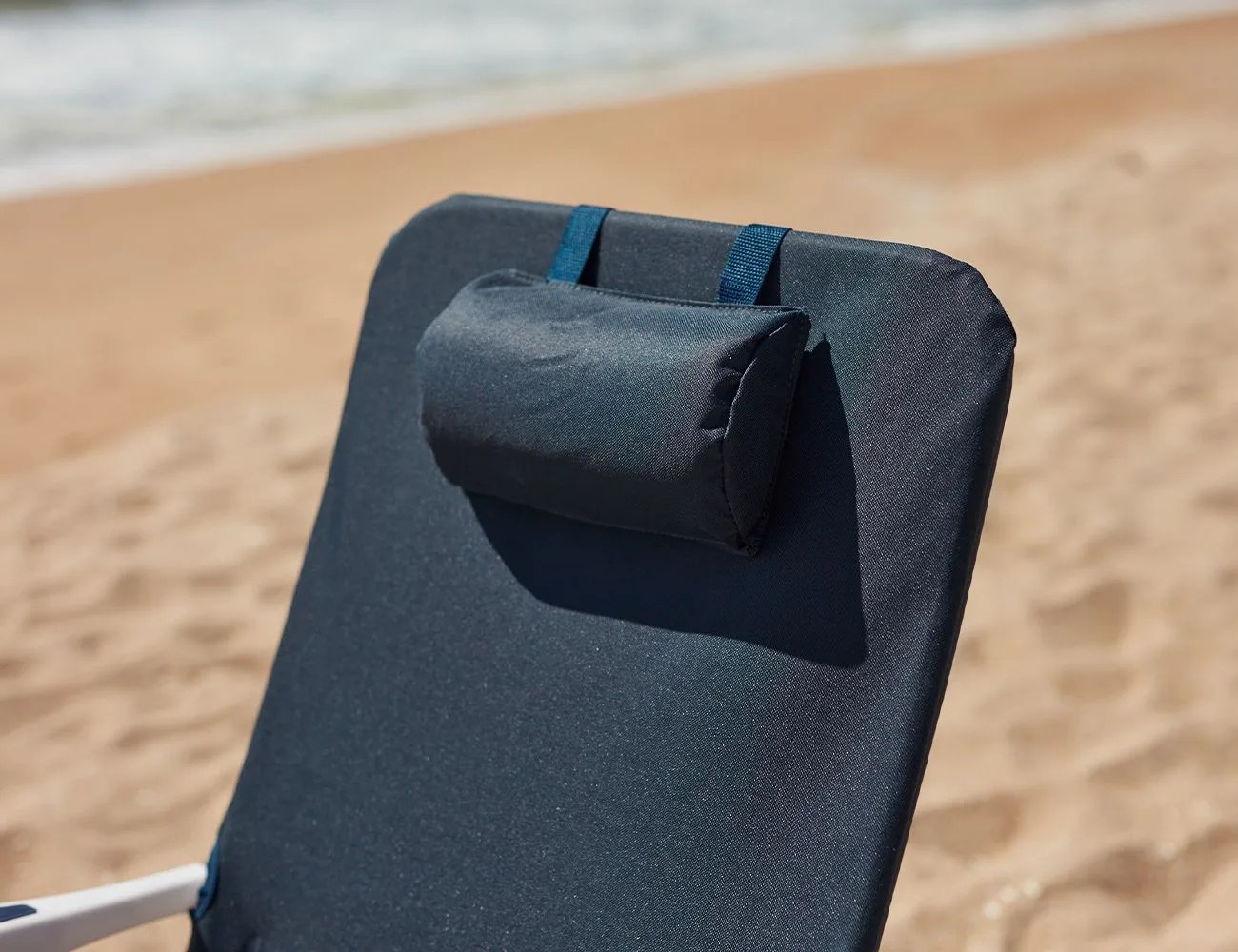 close up of a pillow on a beach chair at the beach
