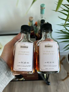 2 bushmills whiskey bottles