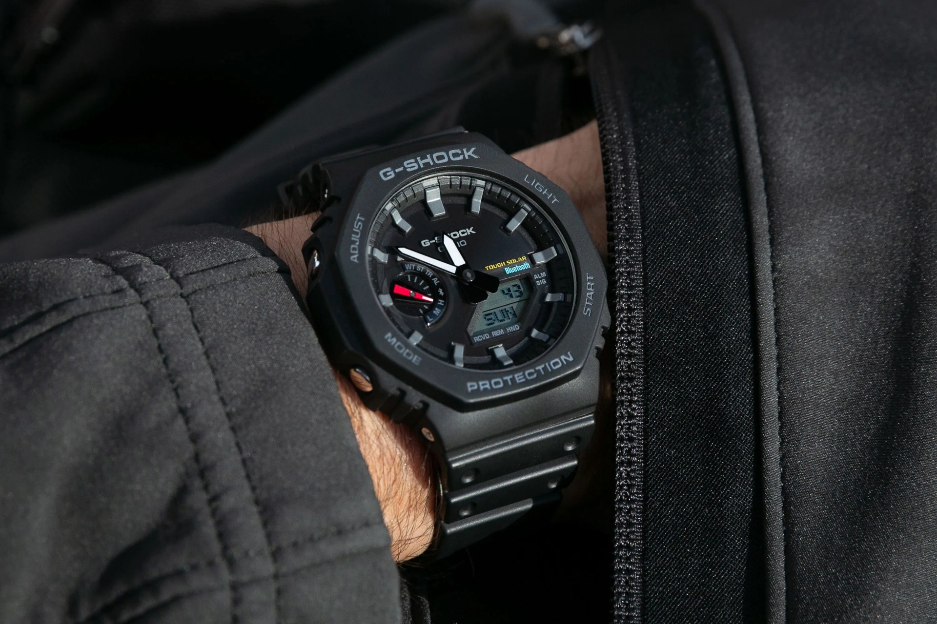 a man wearing a g shock watch