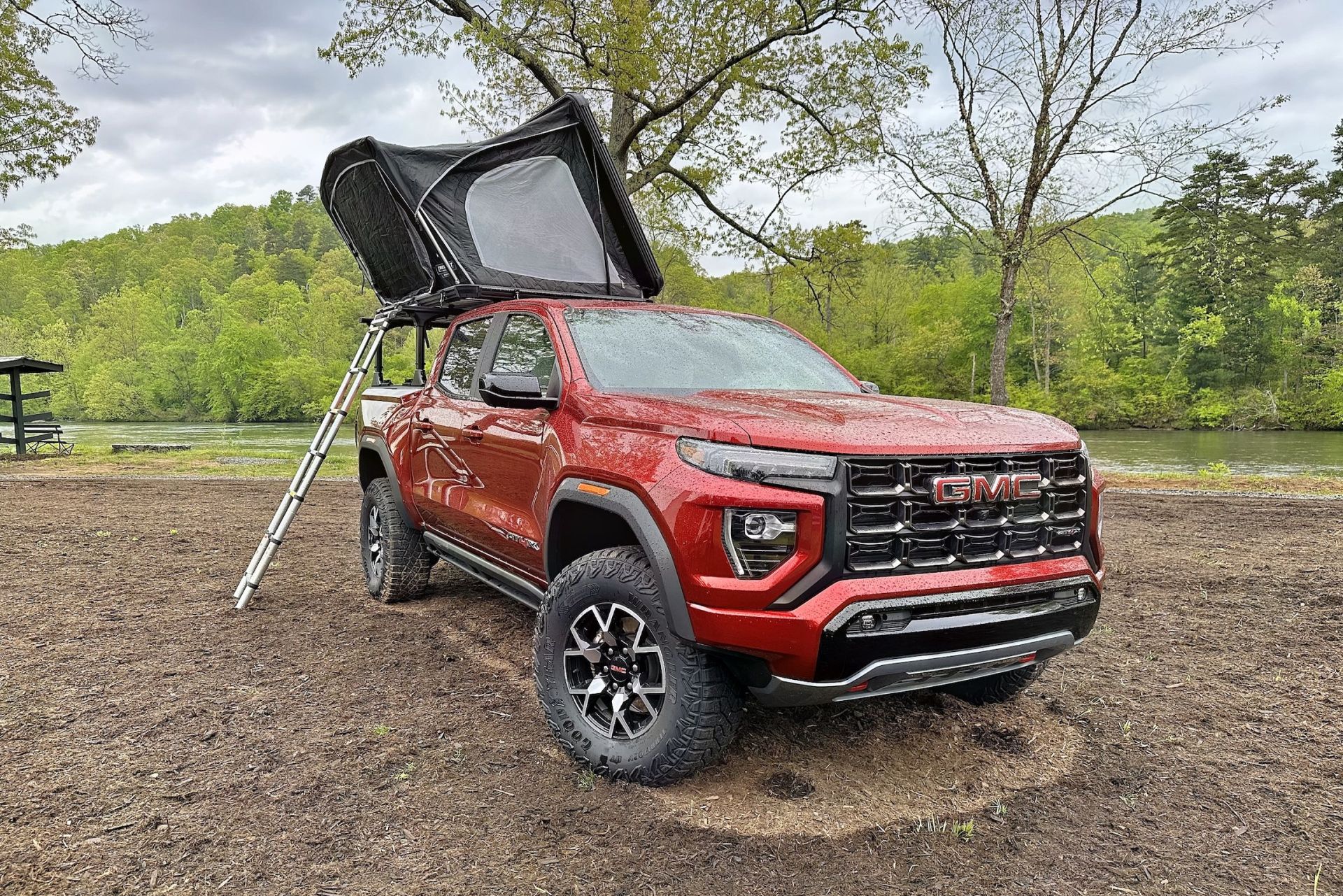 gmc canyon at4x with a rooftop tent on a bed rack