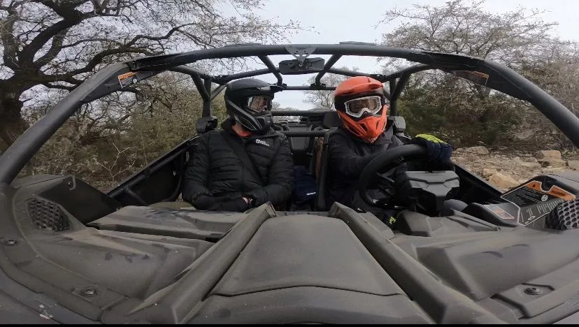 2 people in canam maverick x3