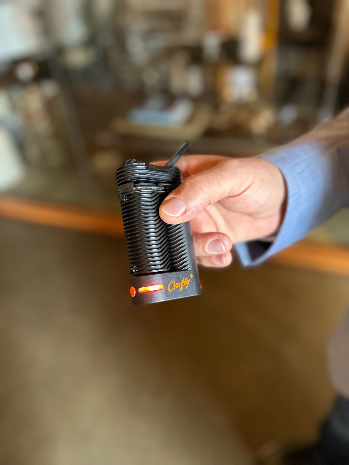 a man holding a weed vape