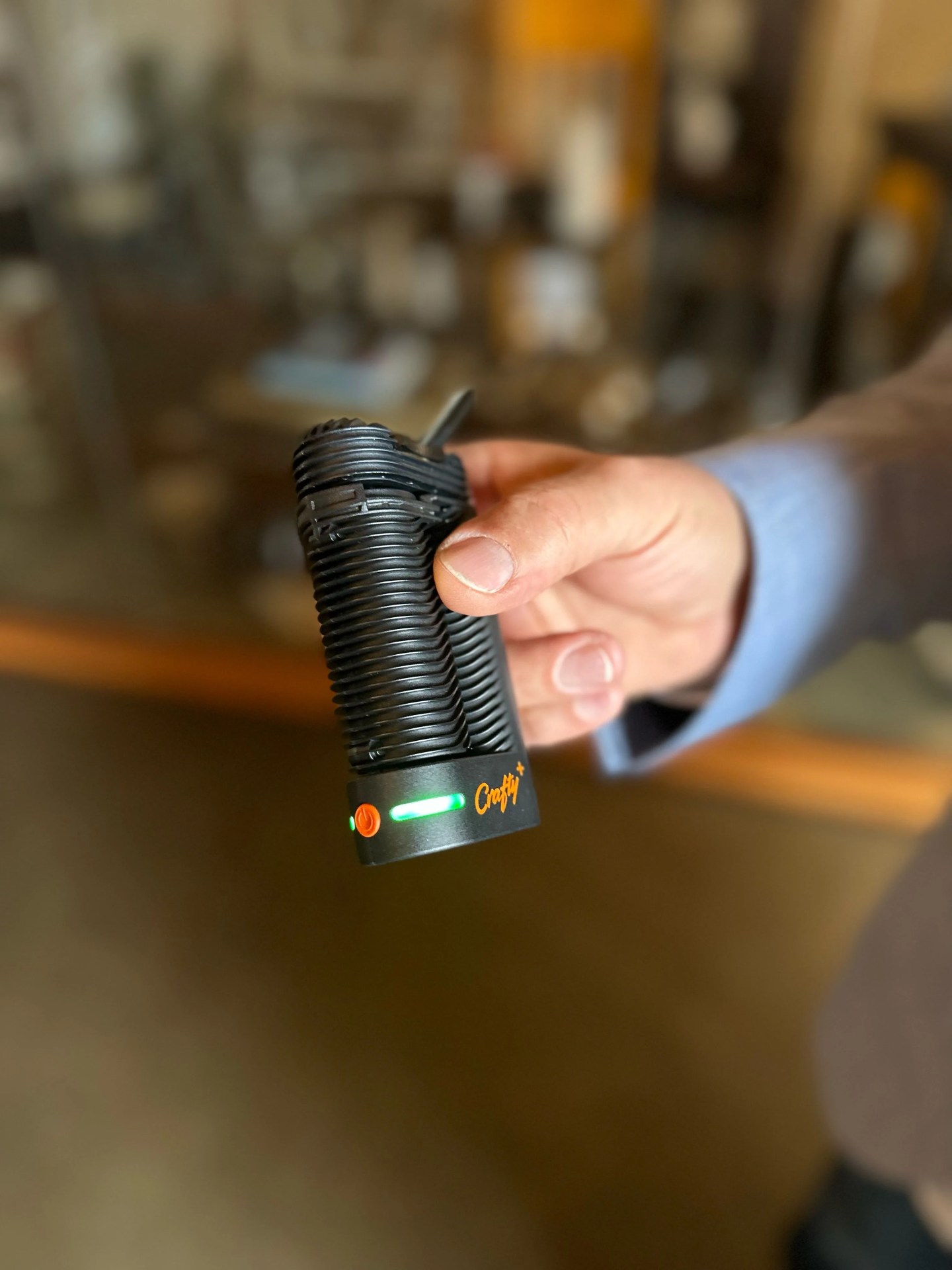 a man holding a weed vape