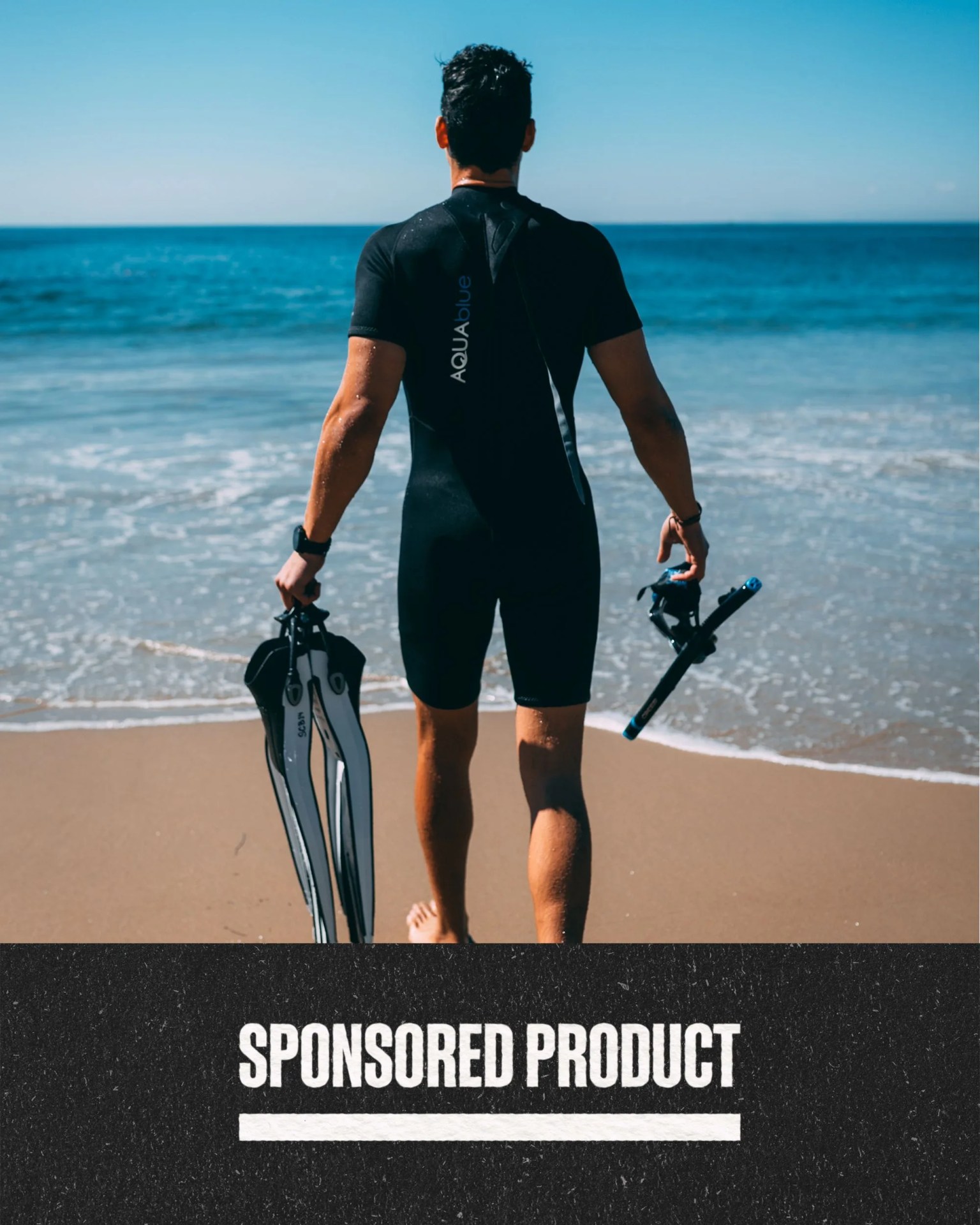 sponsored product man walking towards ocean wearing scuba gear