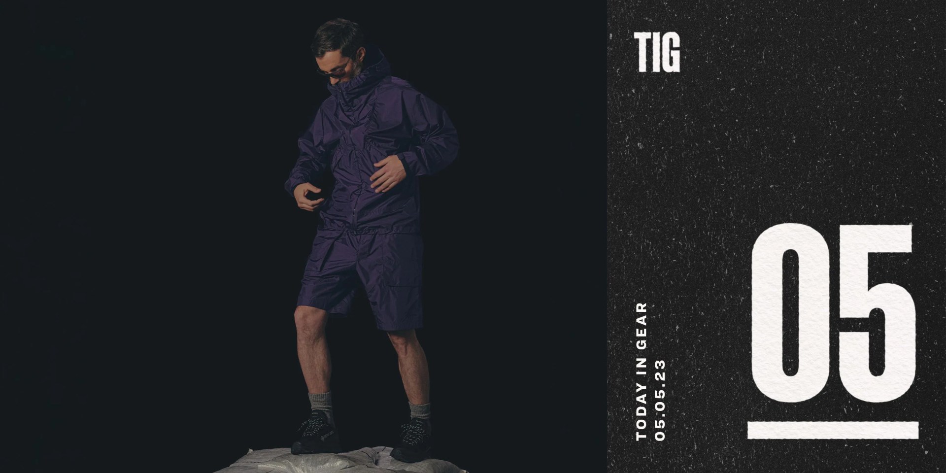 a man wearing a windbreaker jacket and shorts