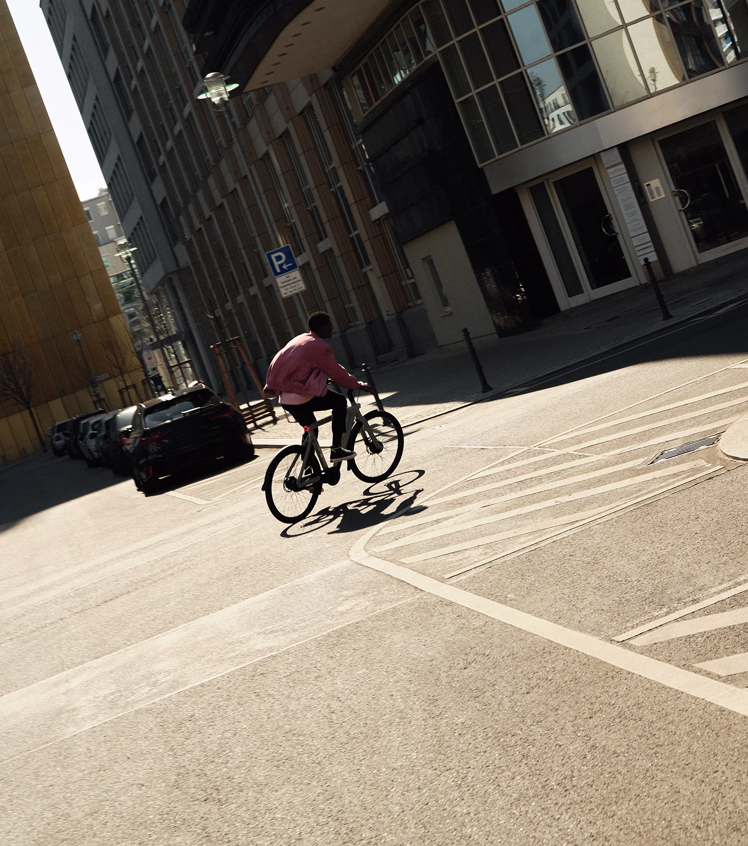 man riding e bike in city