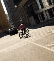man riding e bike in city