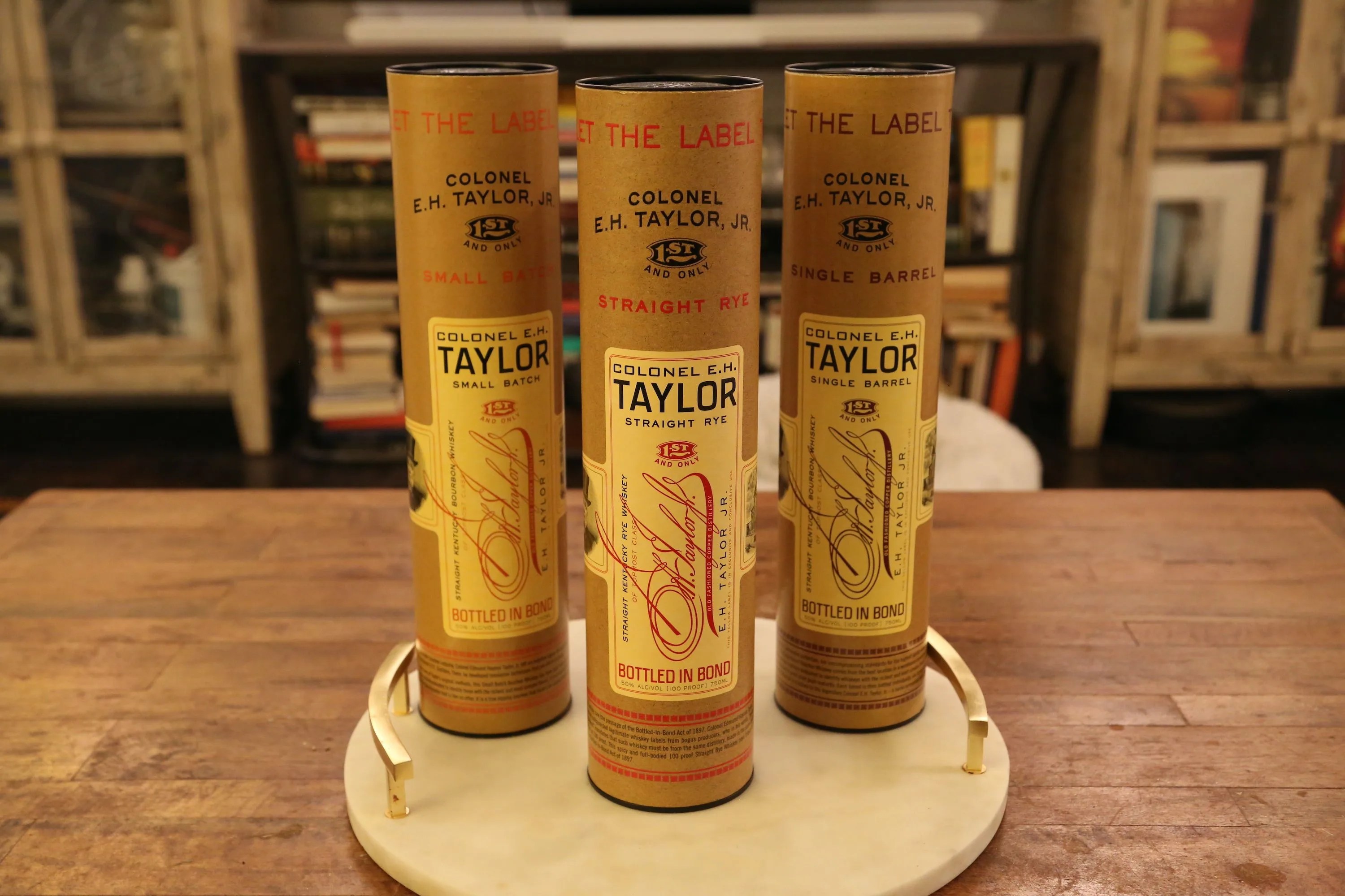 eh taylor whiskey bottles on a table