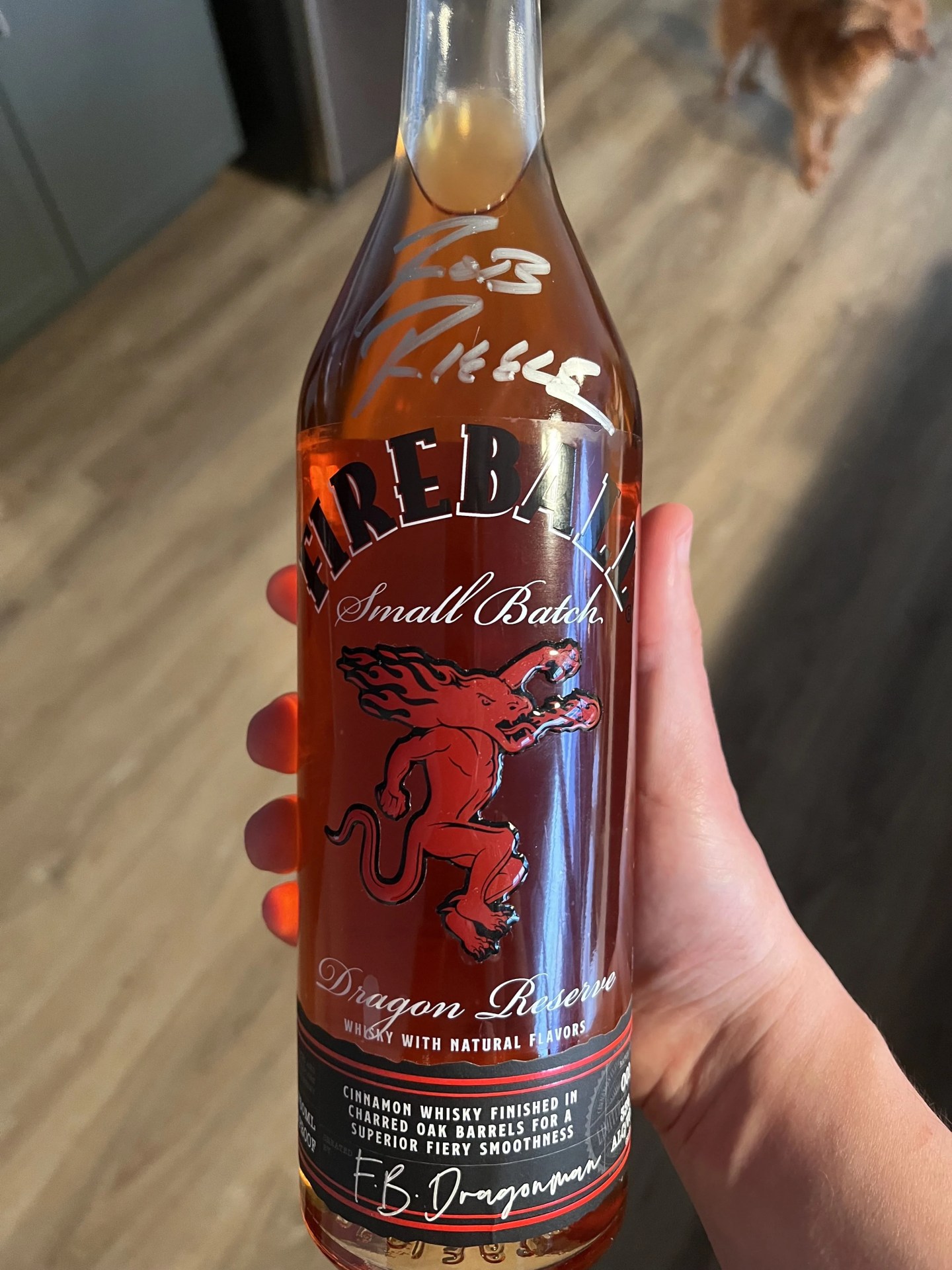 a bottle of fireball dragon reserve signed by rob riggle