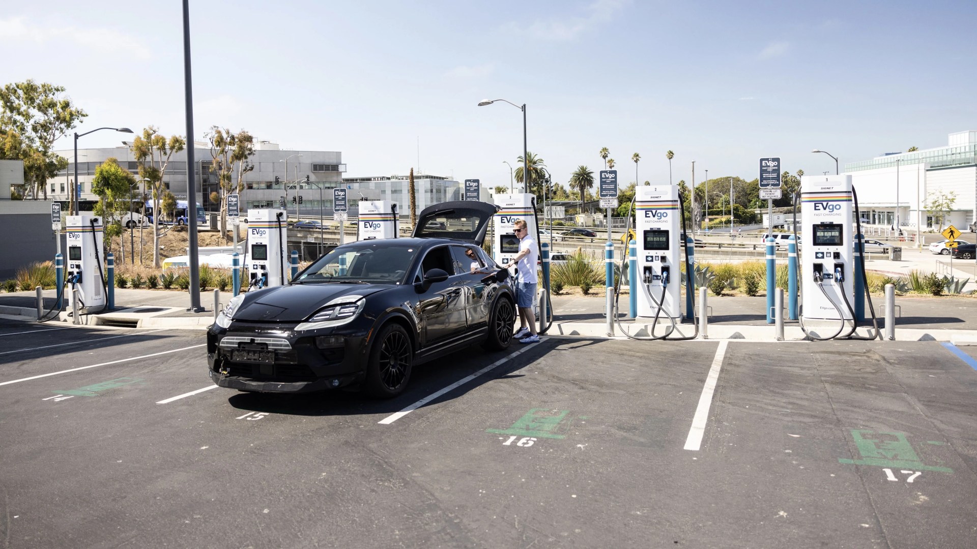 porsche macan ev prototype on a charger testing