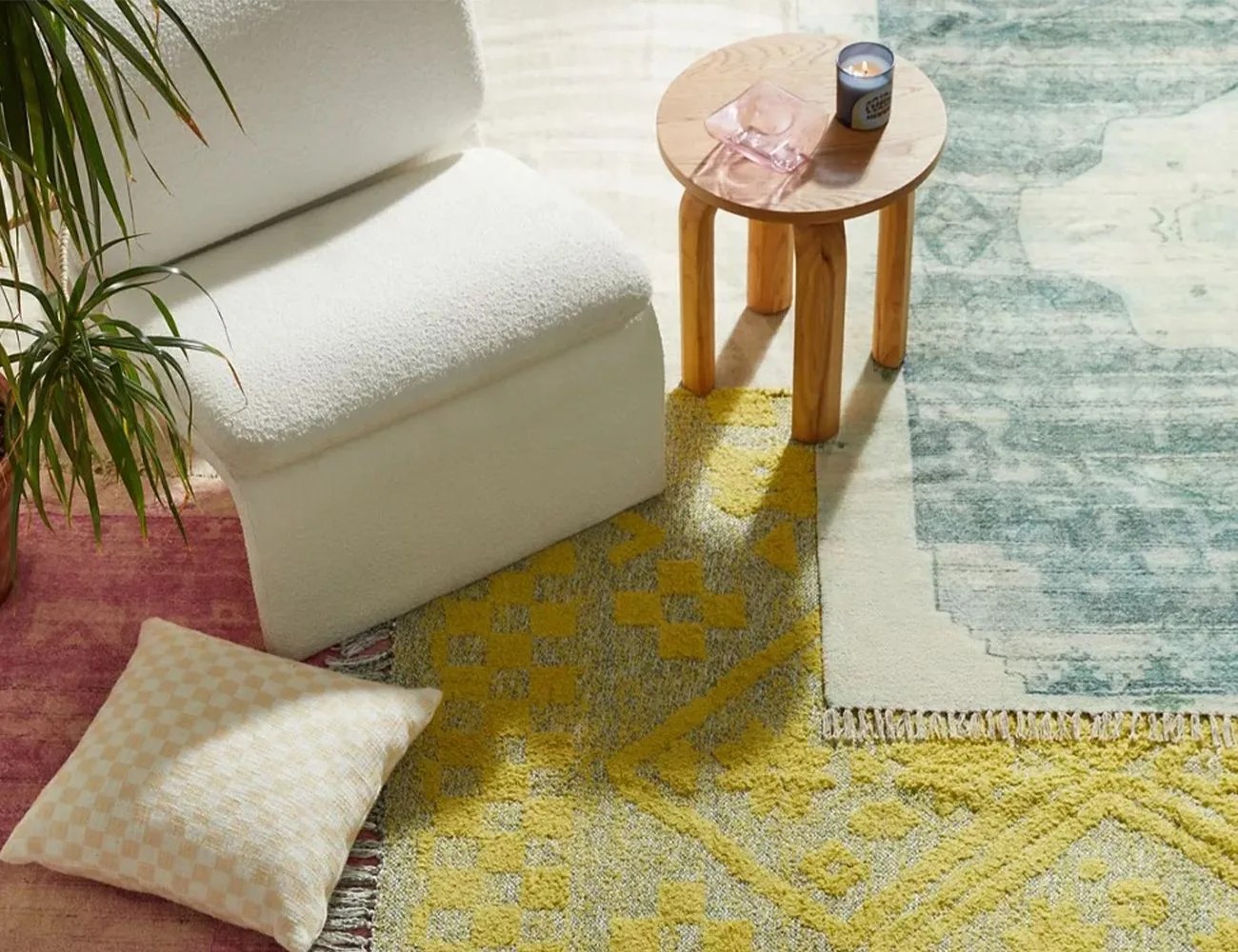 rugs with a pillow, chair and table