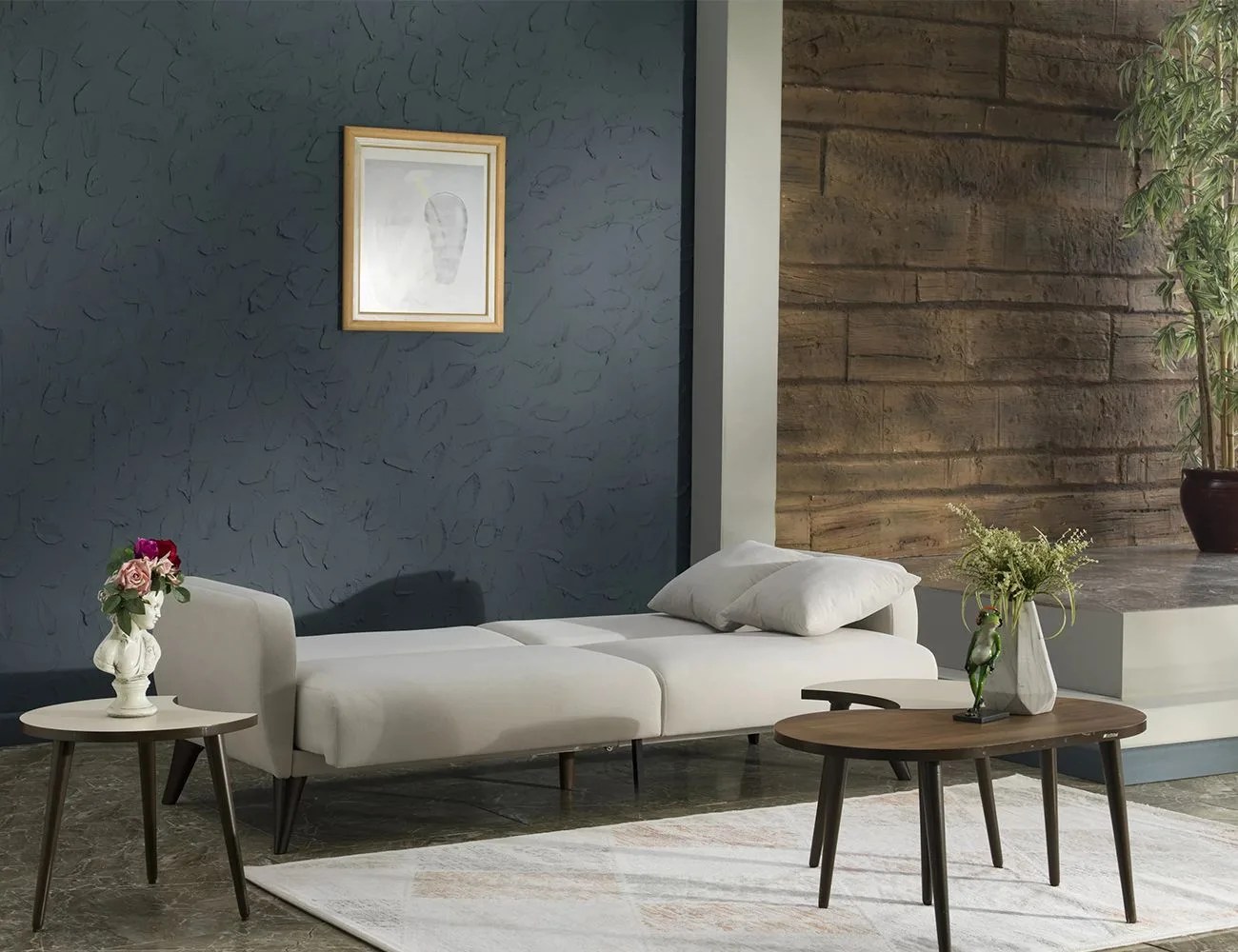 a couch bed in a room with wooden tables