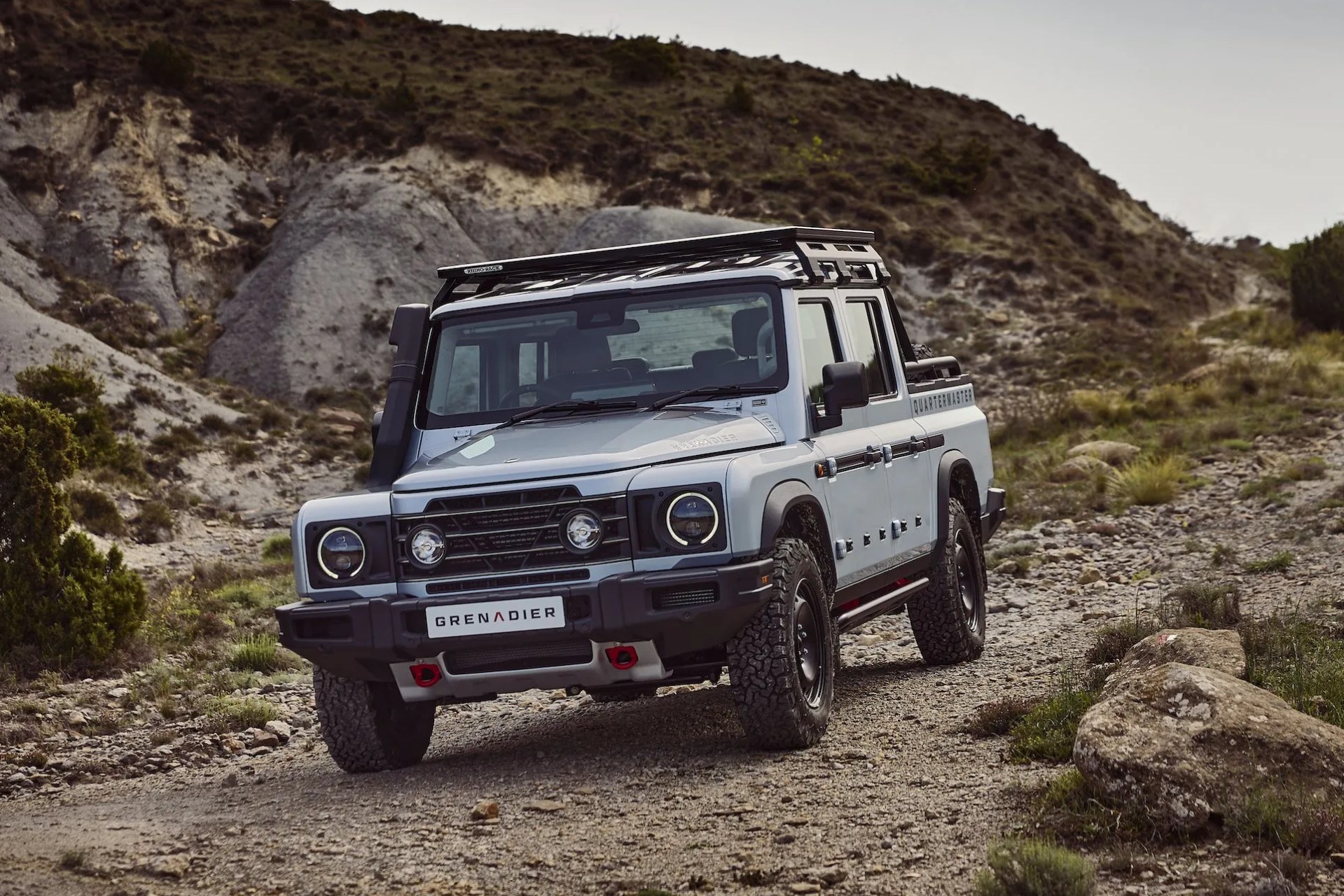 ineos grenadier quartermaster driving on a dirt road