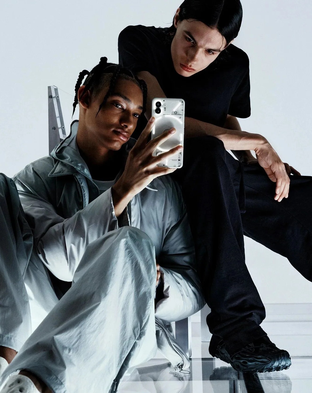 man and woman using nothing phone