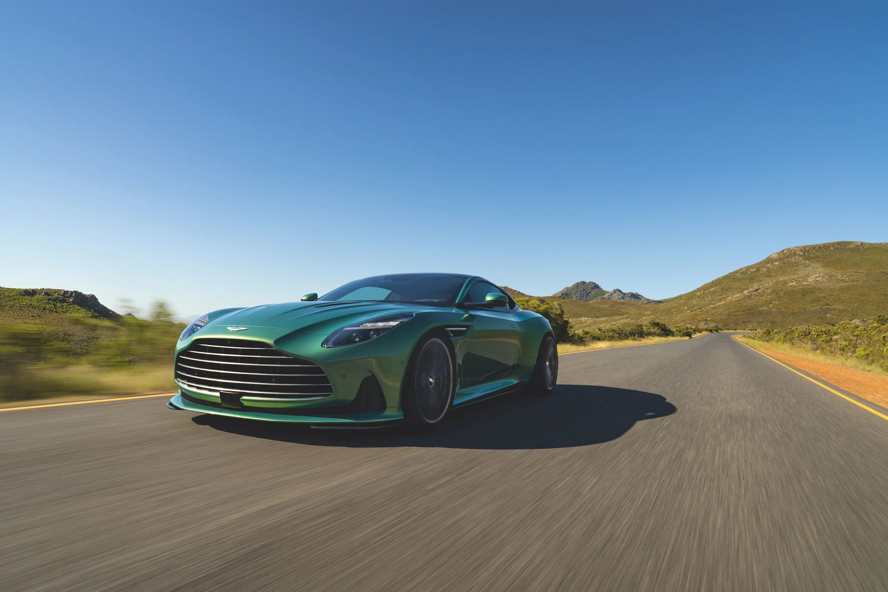 aston martin db12 driving on road