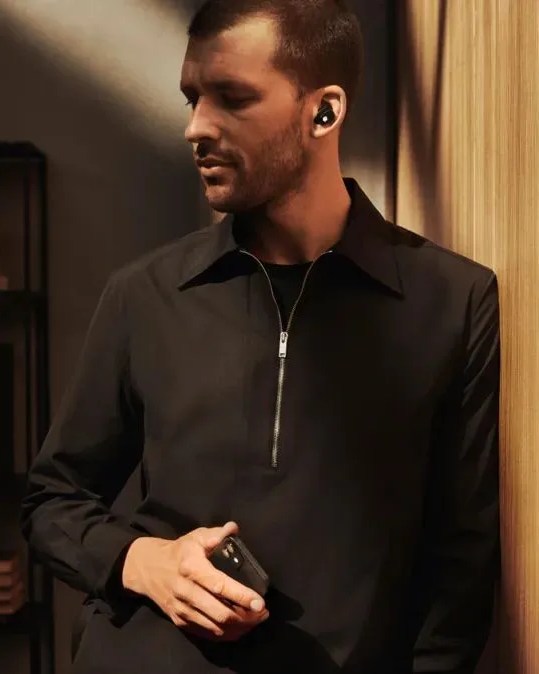 man wearing montblanc mtb 03 in ear headphones