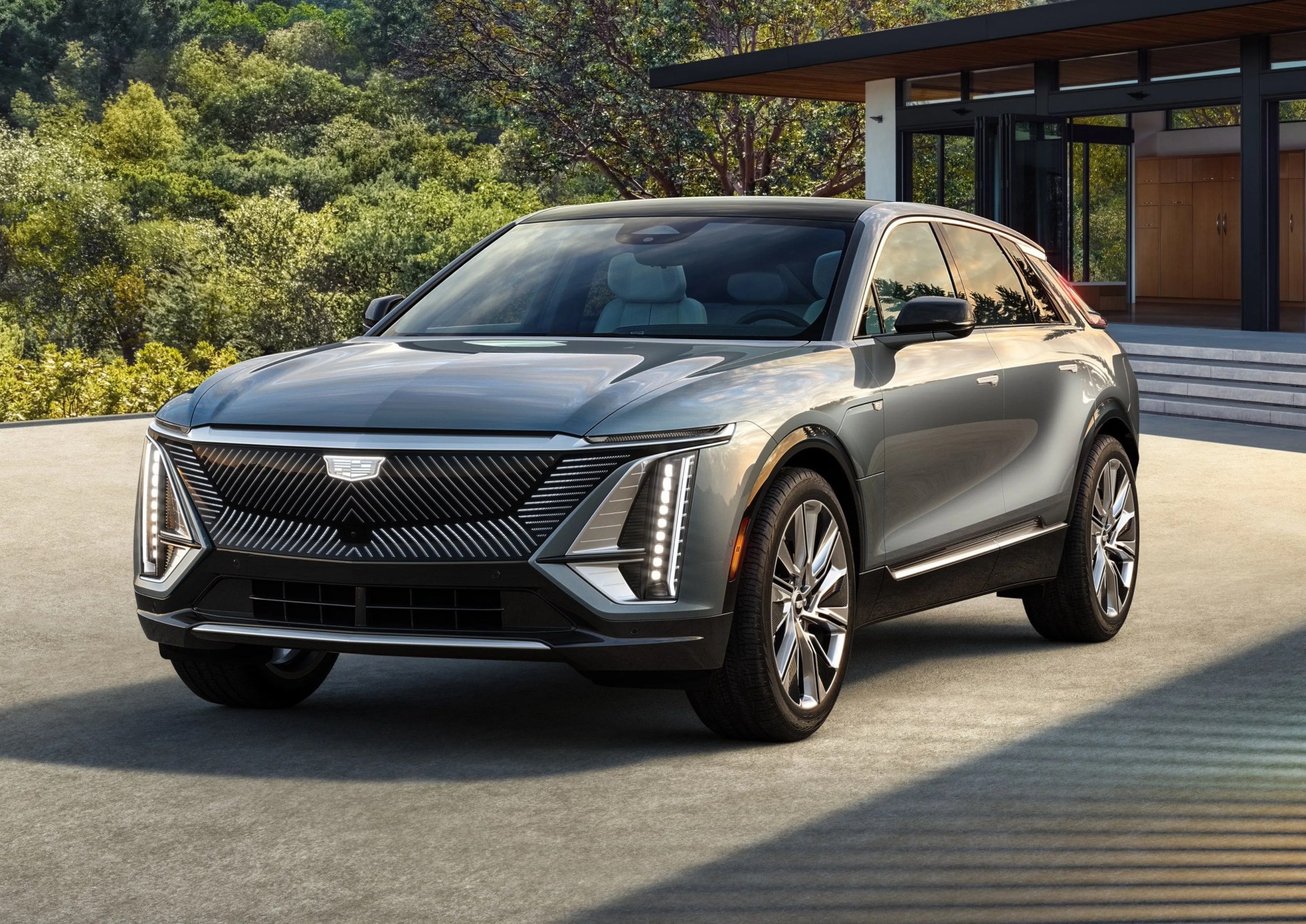 defined by taut lines and clean surfaces, lyriq is assertive and modern, characterized with a low, fast roofline and wide stance that emphasize agility and convey confidence additional details, such as a flow through roof spoiler, express the careful attention paid to aerodynamics to optimize efficiency on the highway