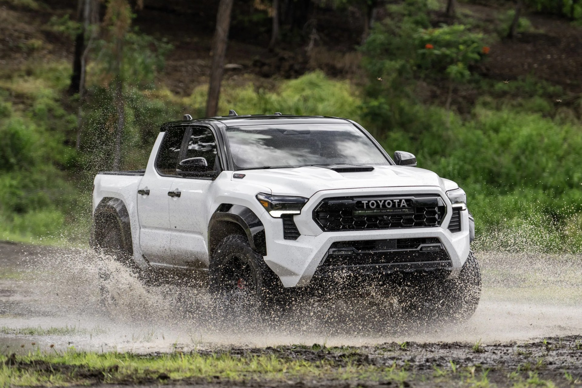 toyota tacoma trd pro driving through mud