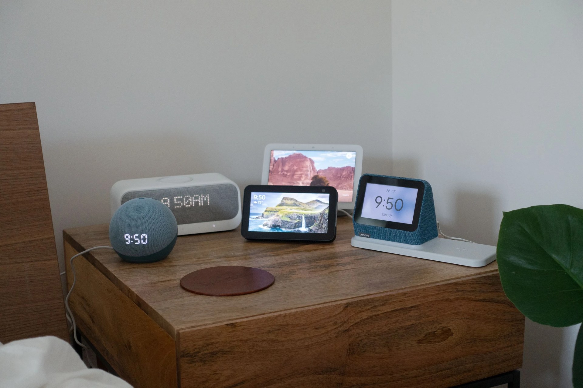 5 smart alarm clocks on a bed side table