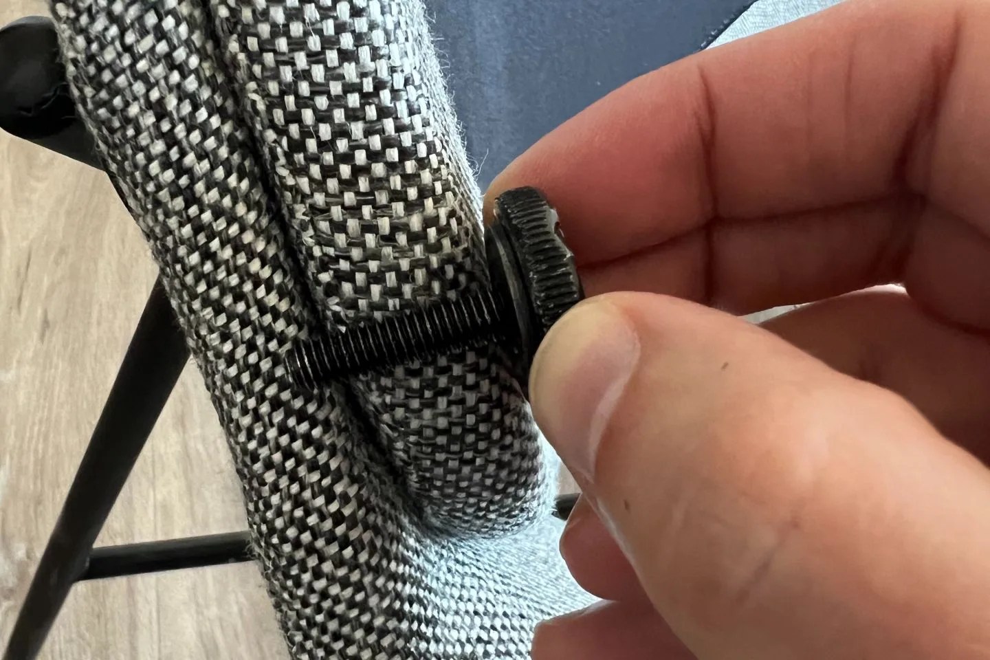 a screw next to a burrow vesper chair