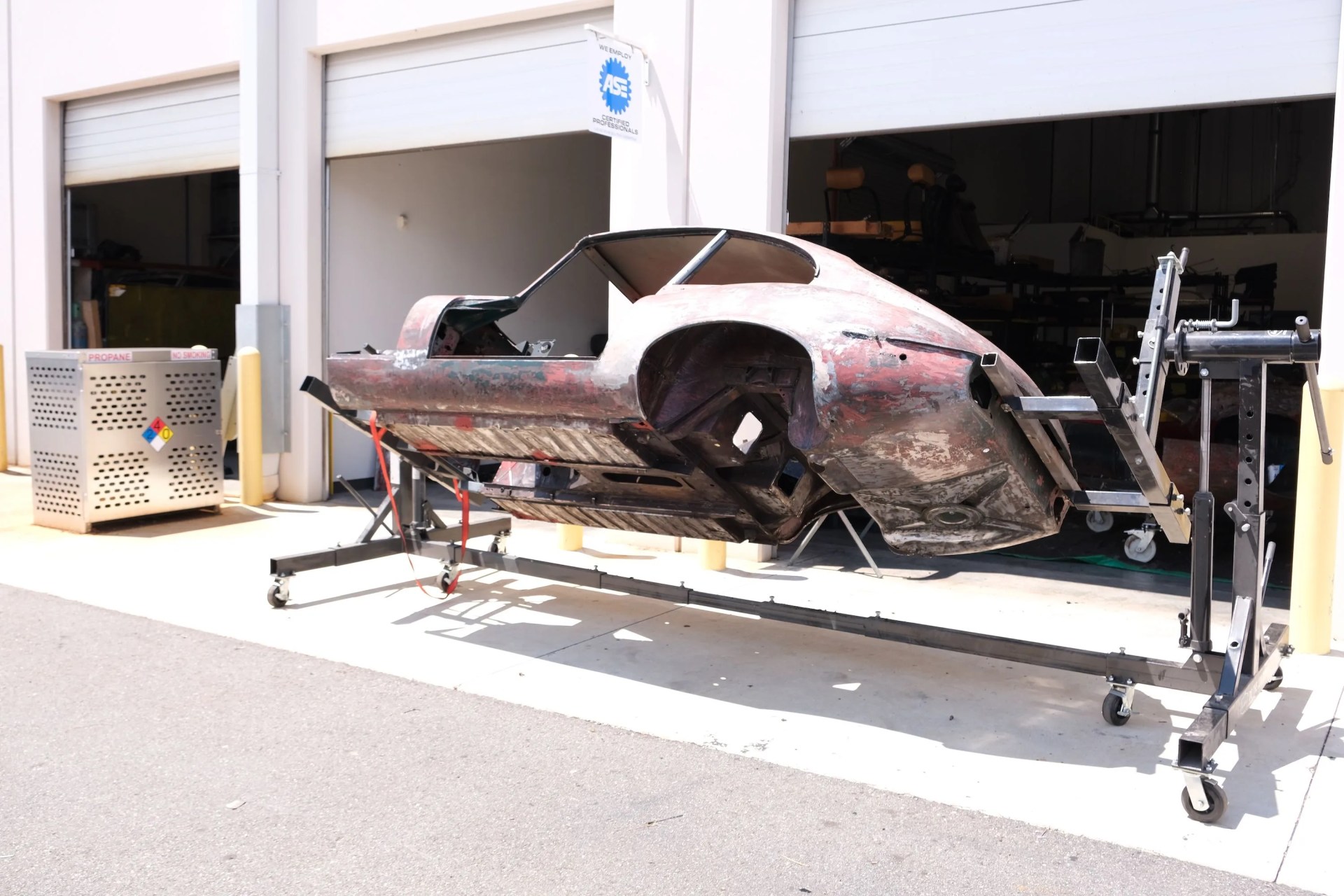 frame of e type jaguar being restored