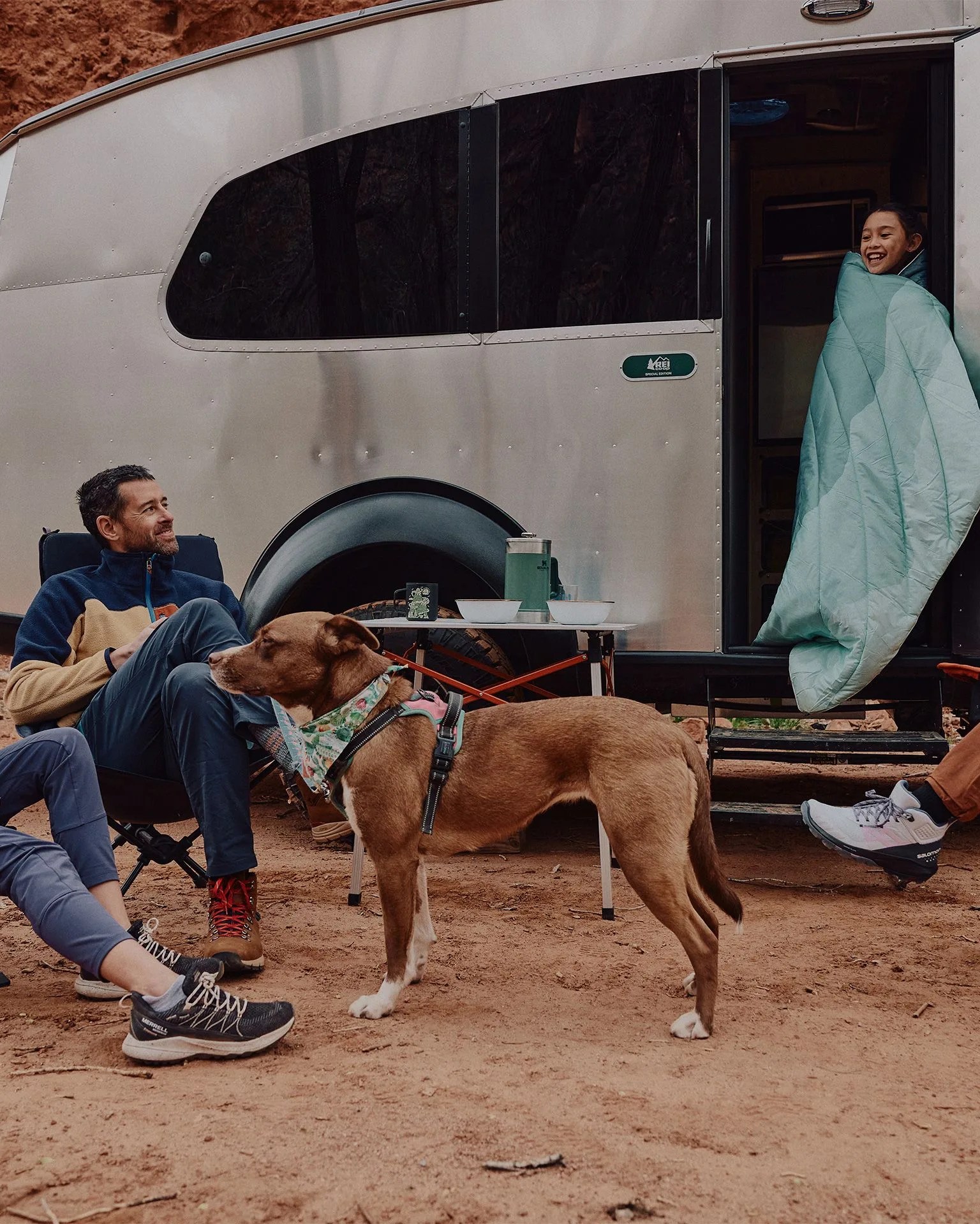 today in gear july 1 2023 three people and a dog hanging out around their airstream rei co op special edition basecamp 20x