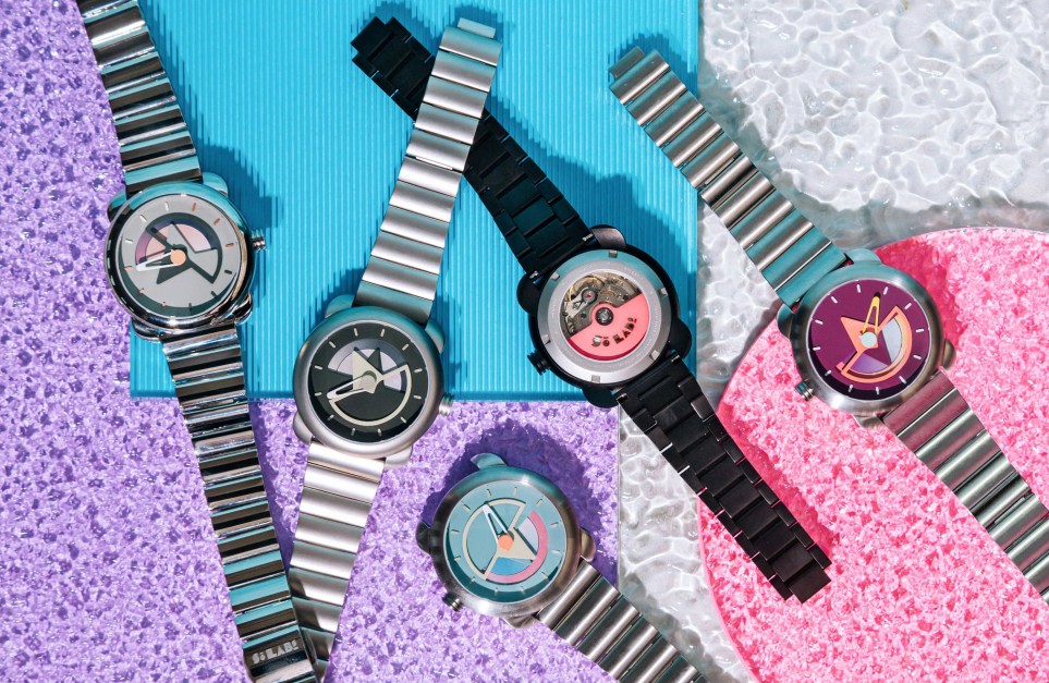 watches laying on a pebbled glass background