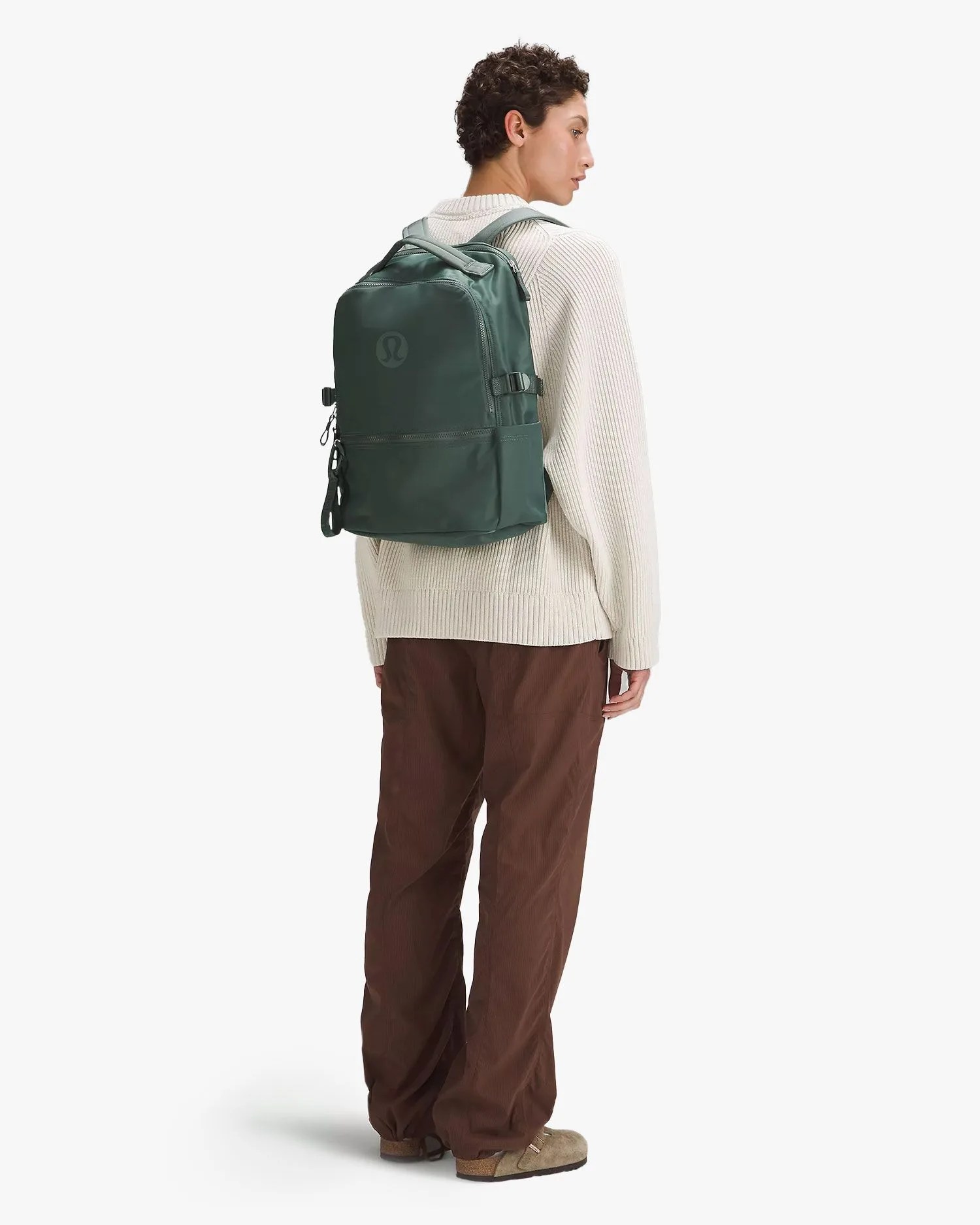 man wearing lululemon new crew backpack 22l